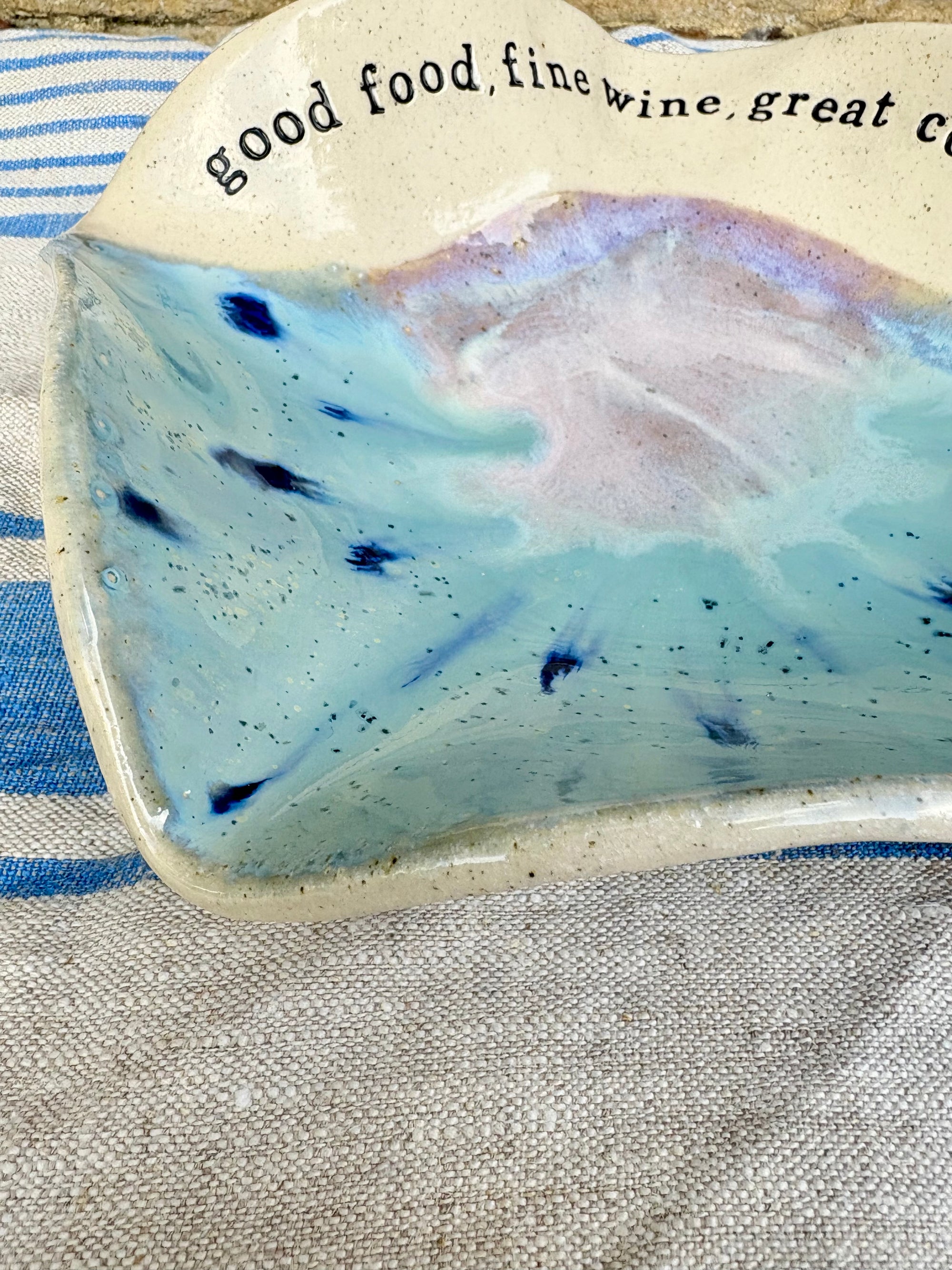 "good food, fine wine, great company..." serving dish