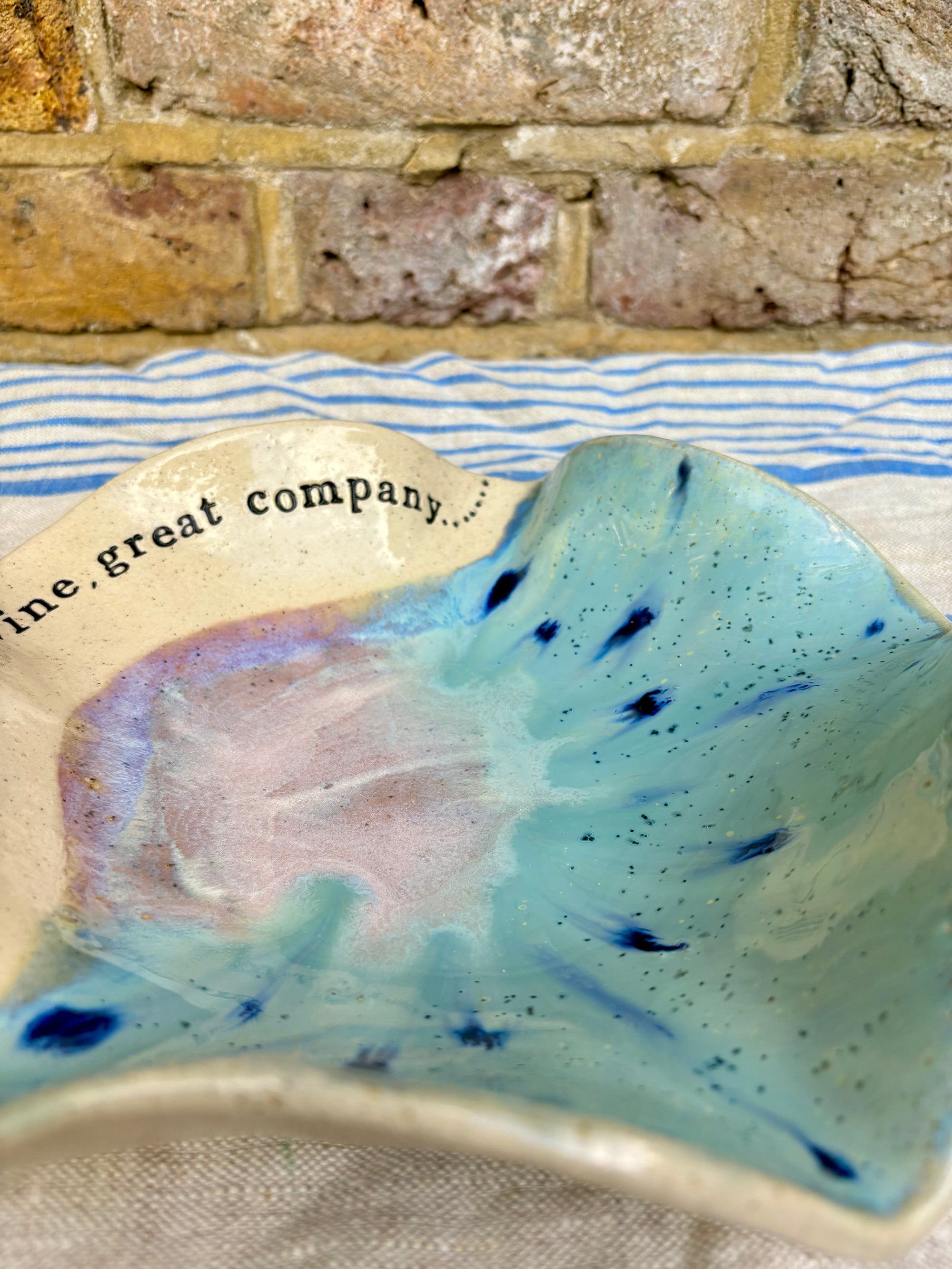 "good food, fine wine, great company..." serving dish