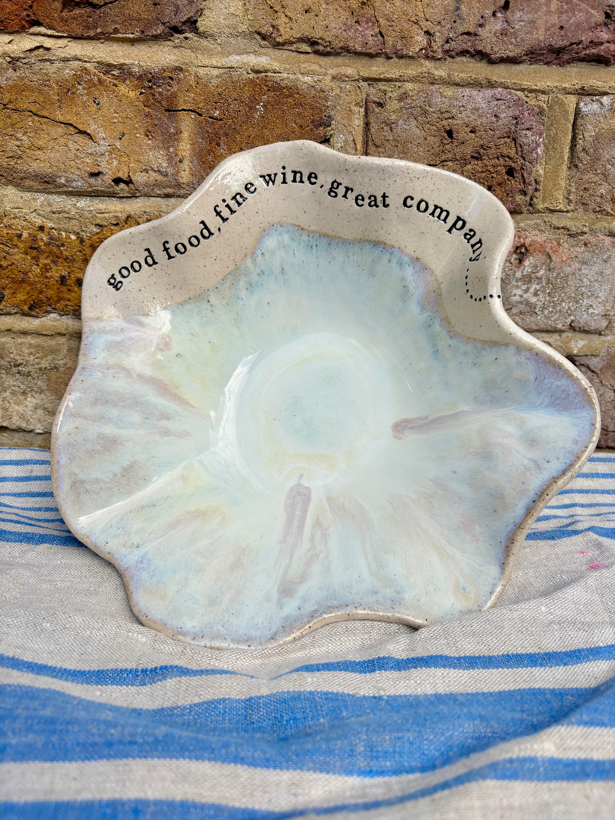 "good food, fine wine, great company..." serving dish