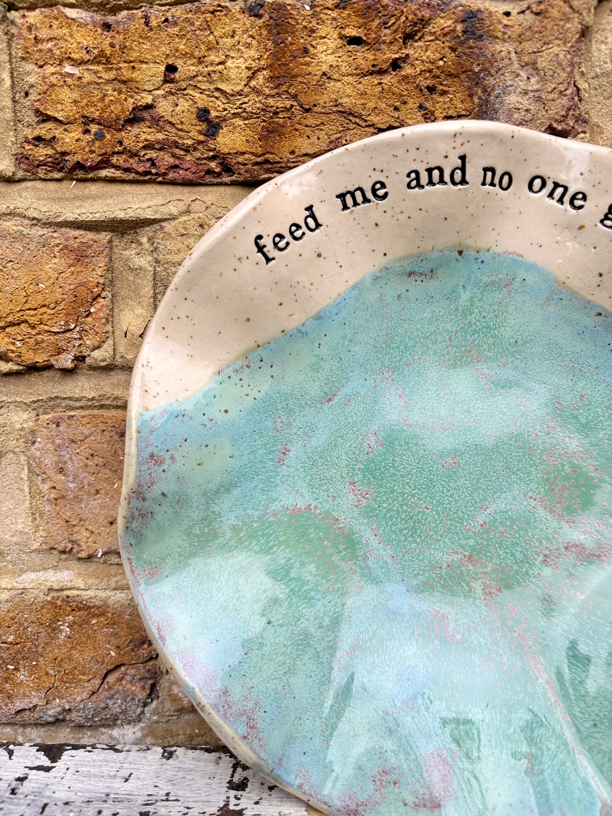 "feed me and no one gets hurt"  serving dish