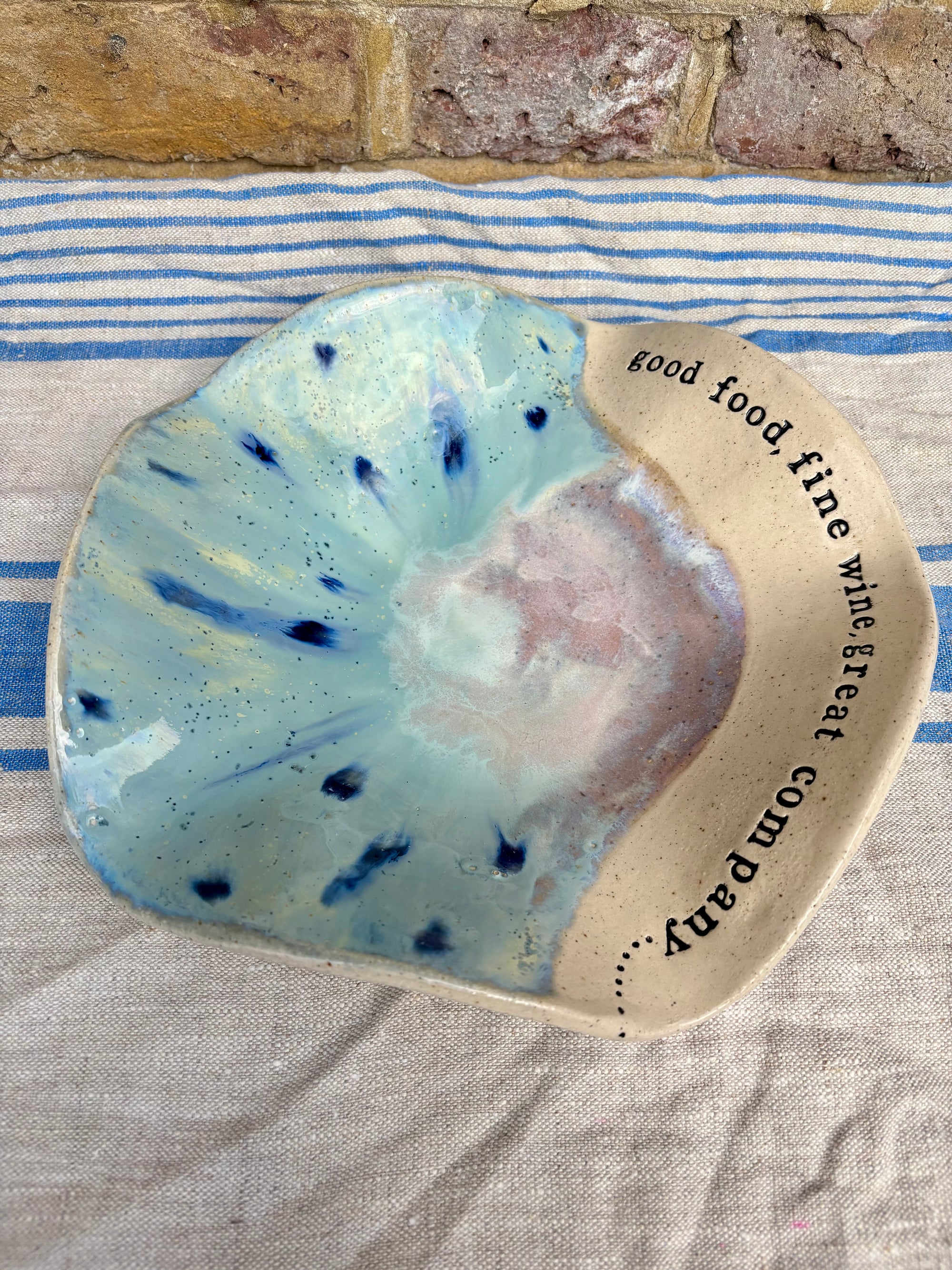 "good food, fine wine, great company..." serving dish