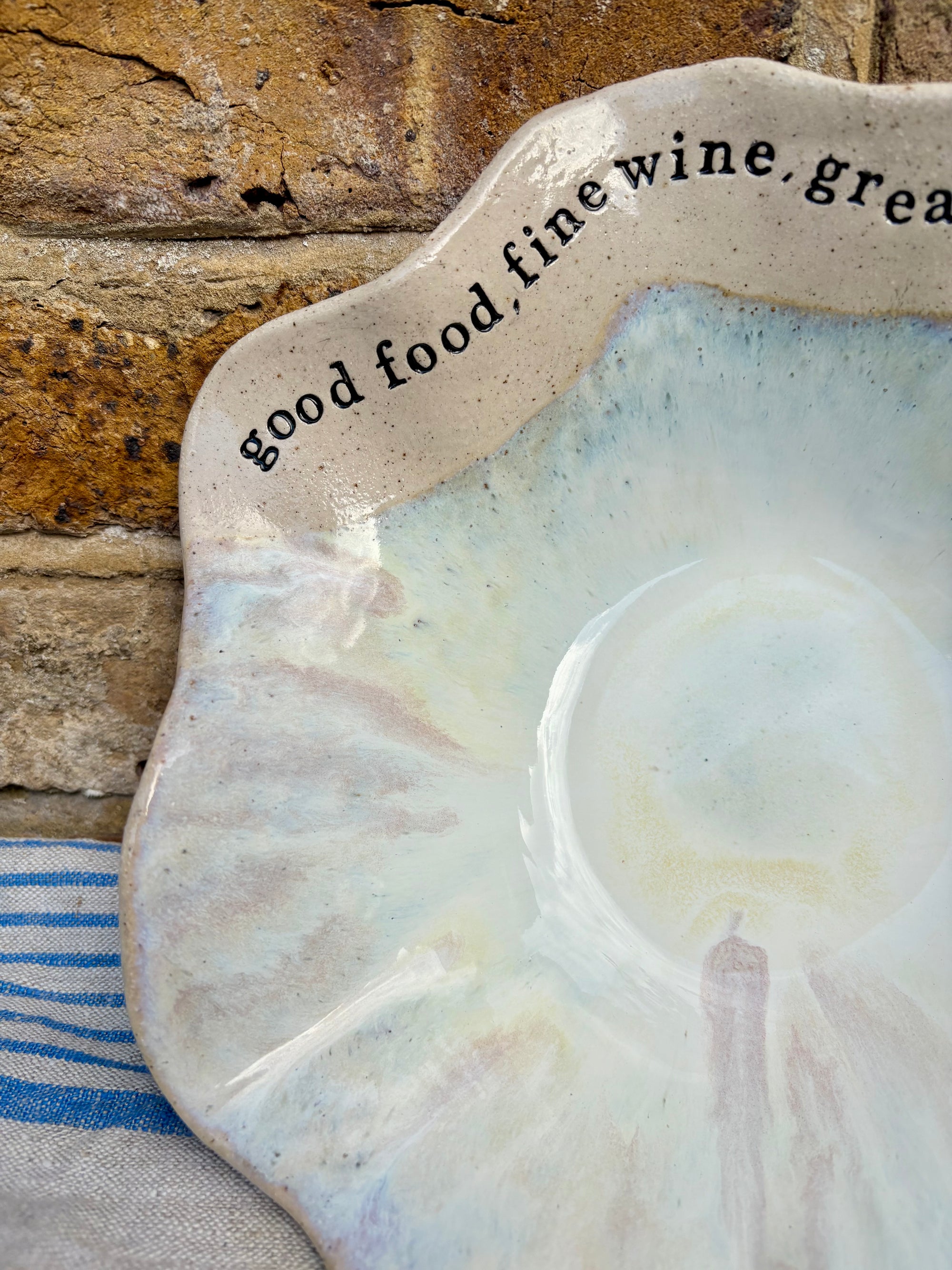 "good food, fine wine, great company..." serving dish