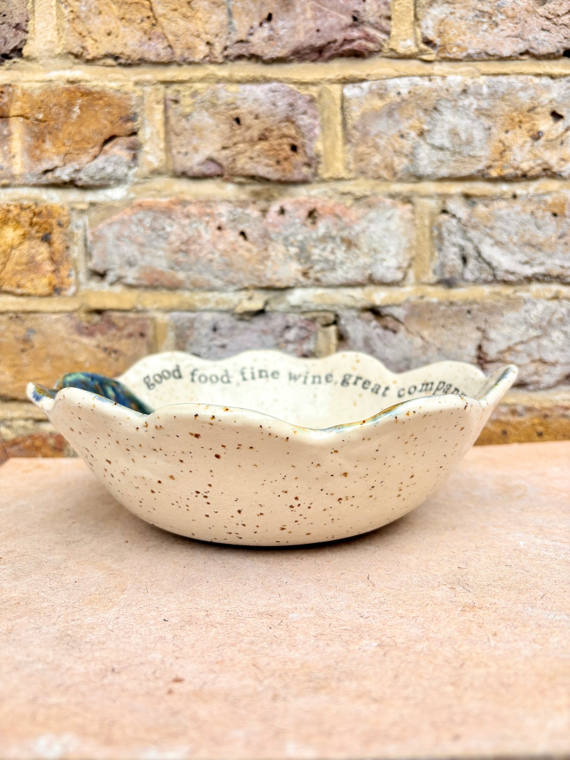 "good food, fine wine, great company..." deep salad/serving dish