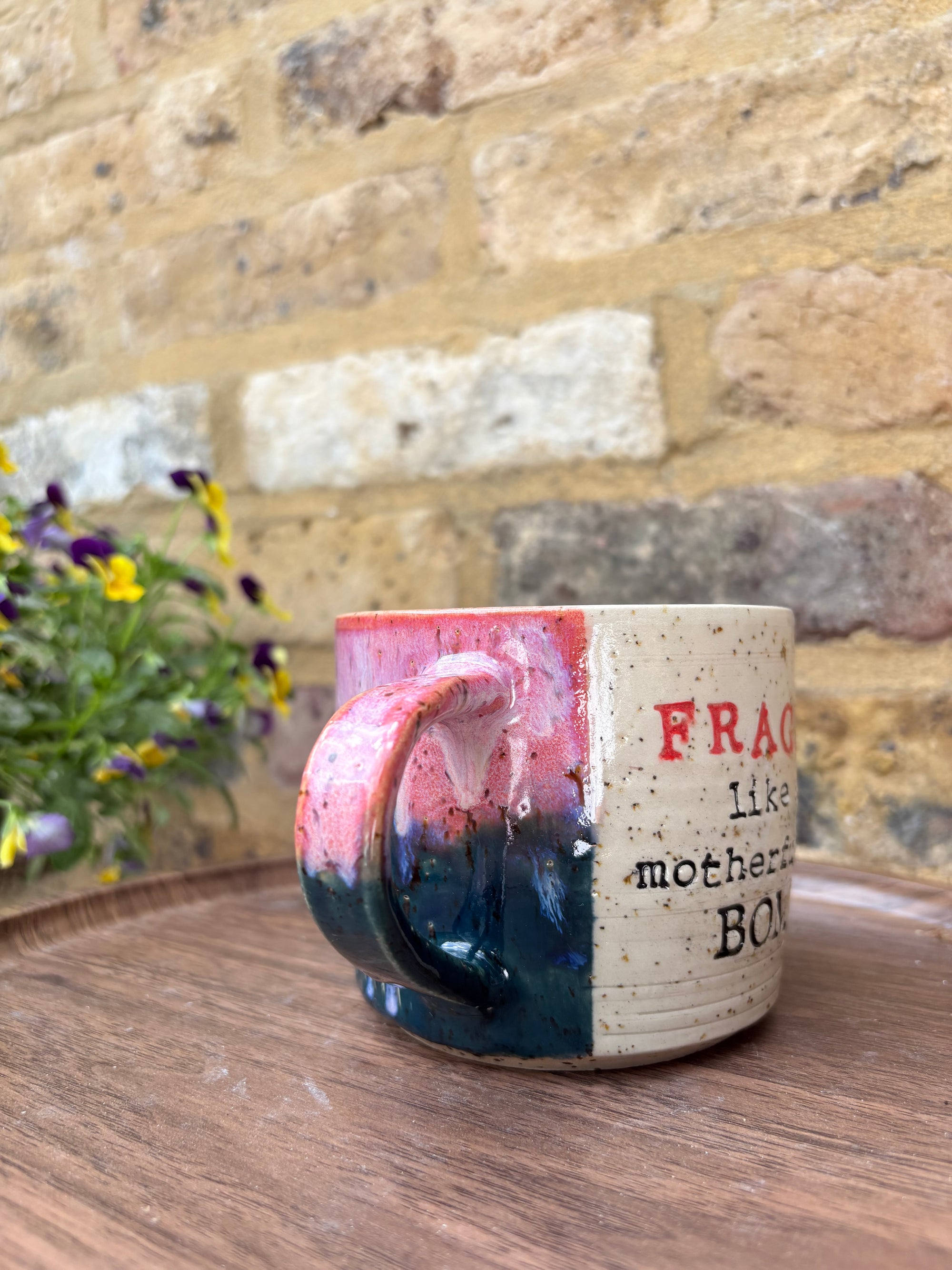 "FRAGILE like a motherfucking bomb" mug (pink/ green)