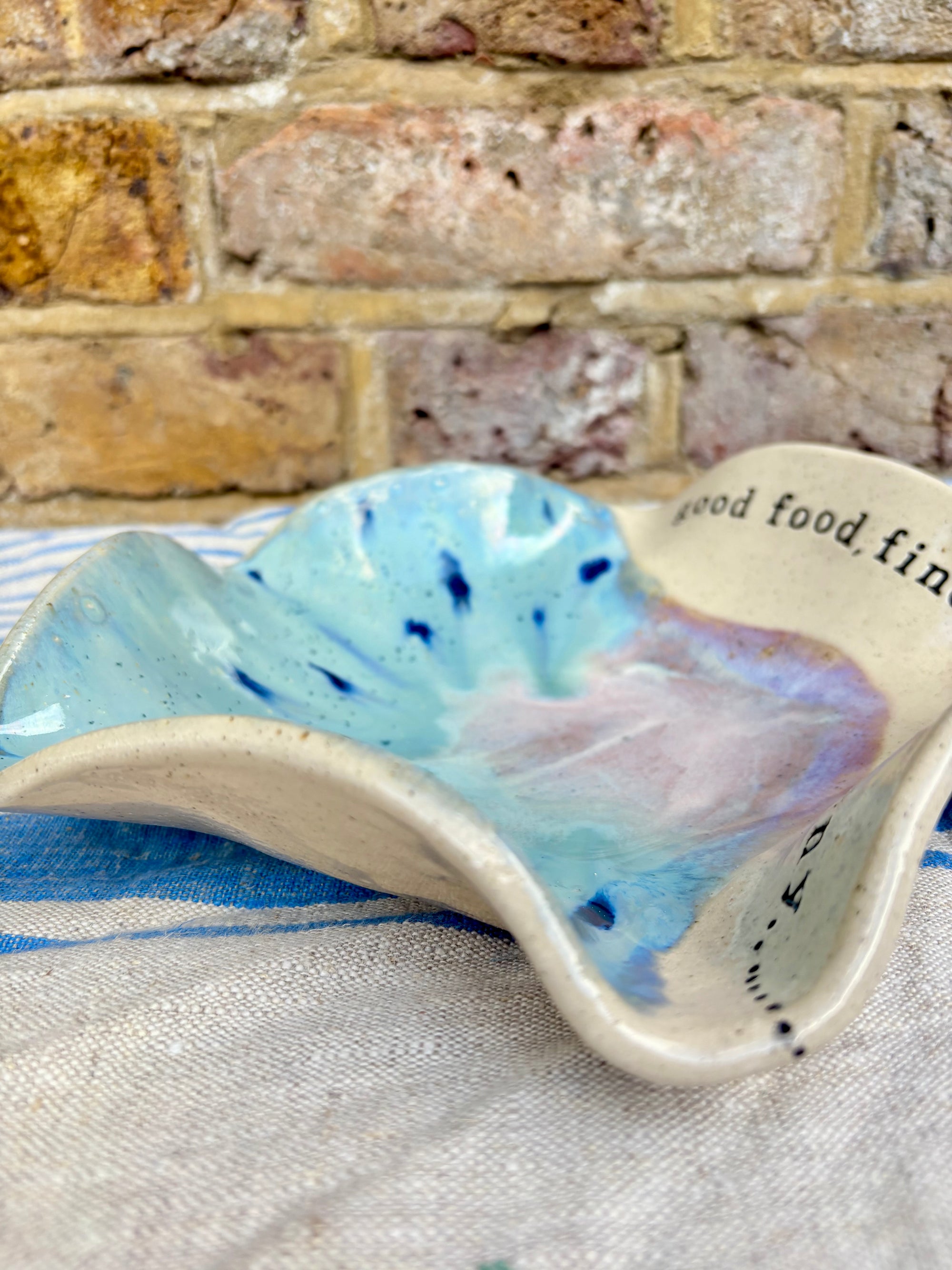 "good food, fine wine, great company..." serving dish