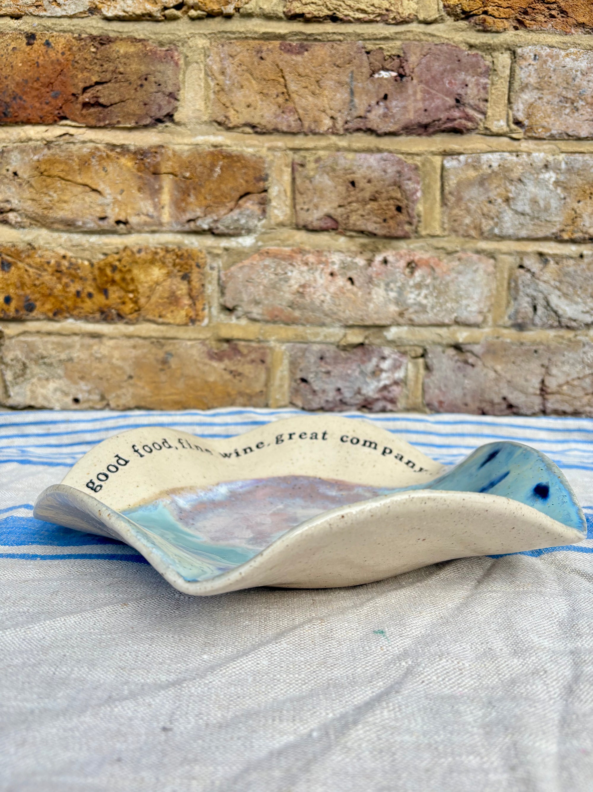 "good food, fine wine, great company..." serving dish