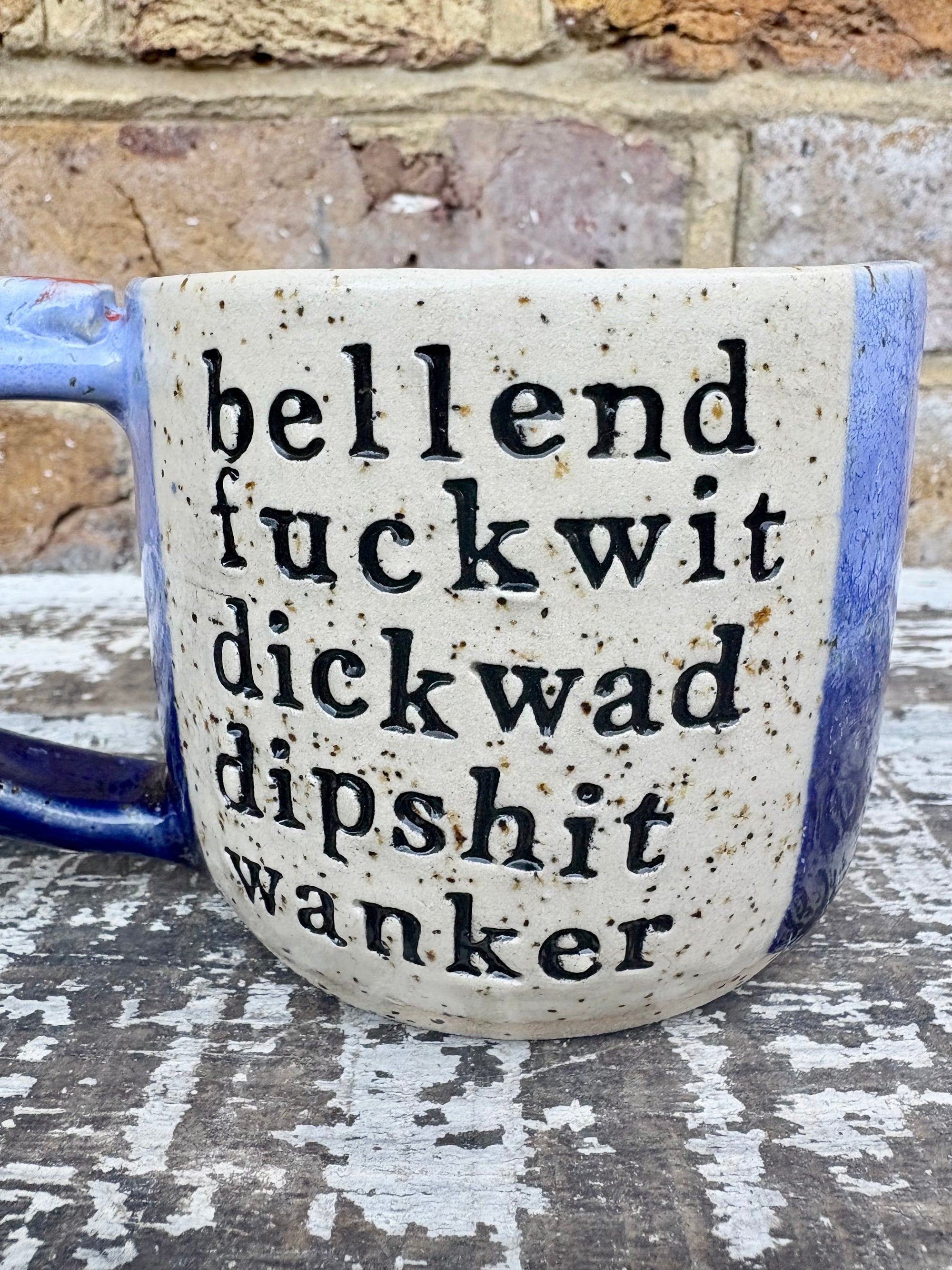 "bellend fuckwit dickwad dipshit wanker" mug (Blues)