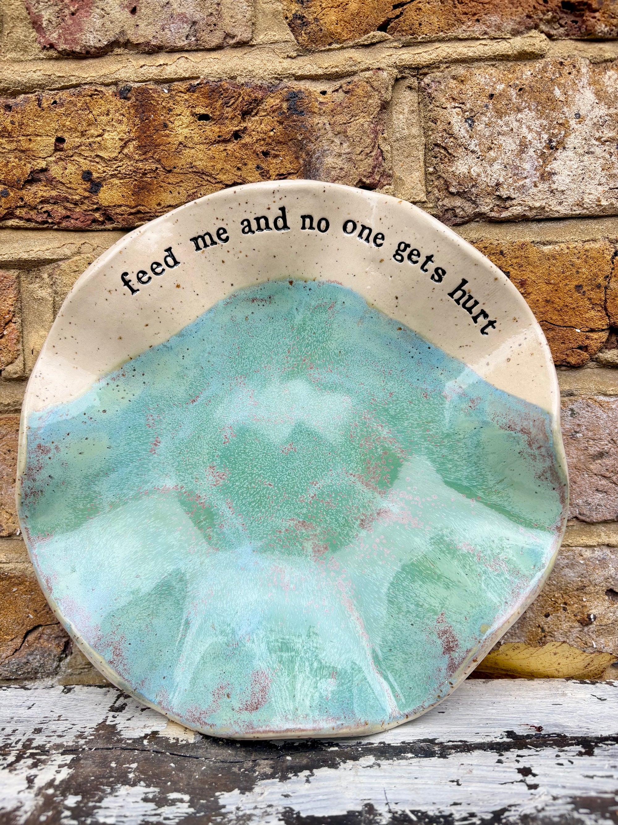 "feed me and no one gets hurt"  serving dish