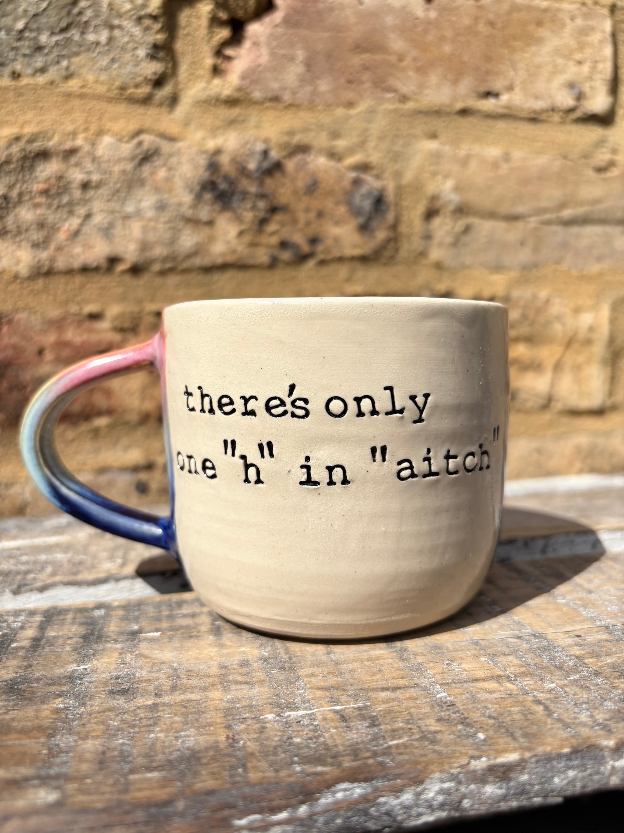 "there's only one "h" in "aitch" mug (pink night sky)