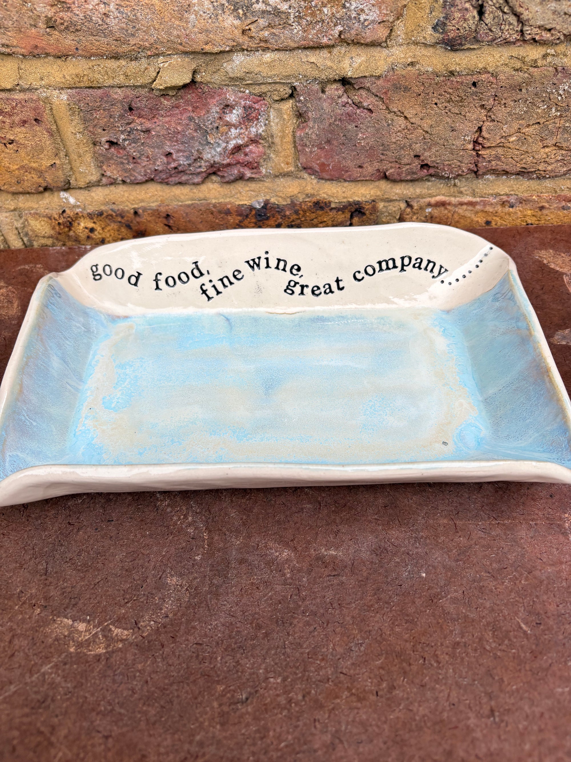 “good food, fine wine, great company..." rectangular salad/serving dish