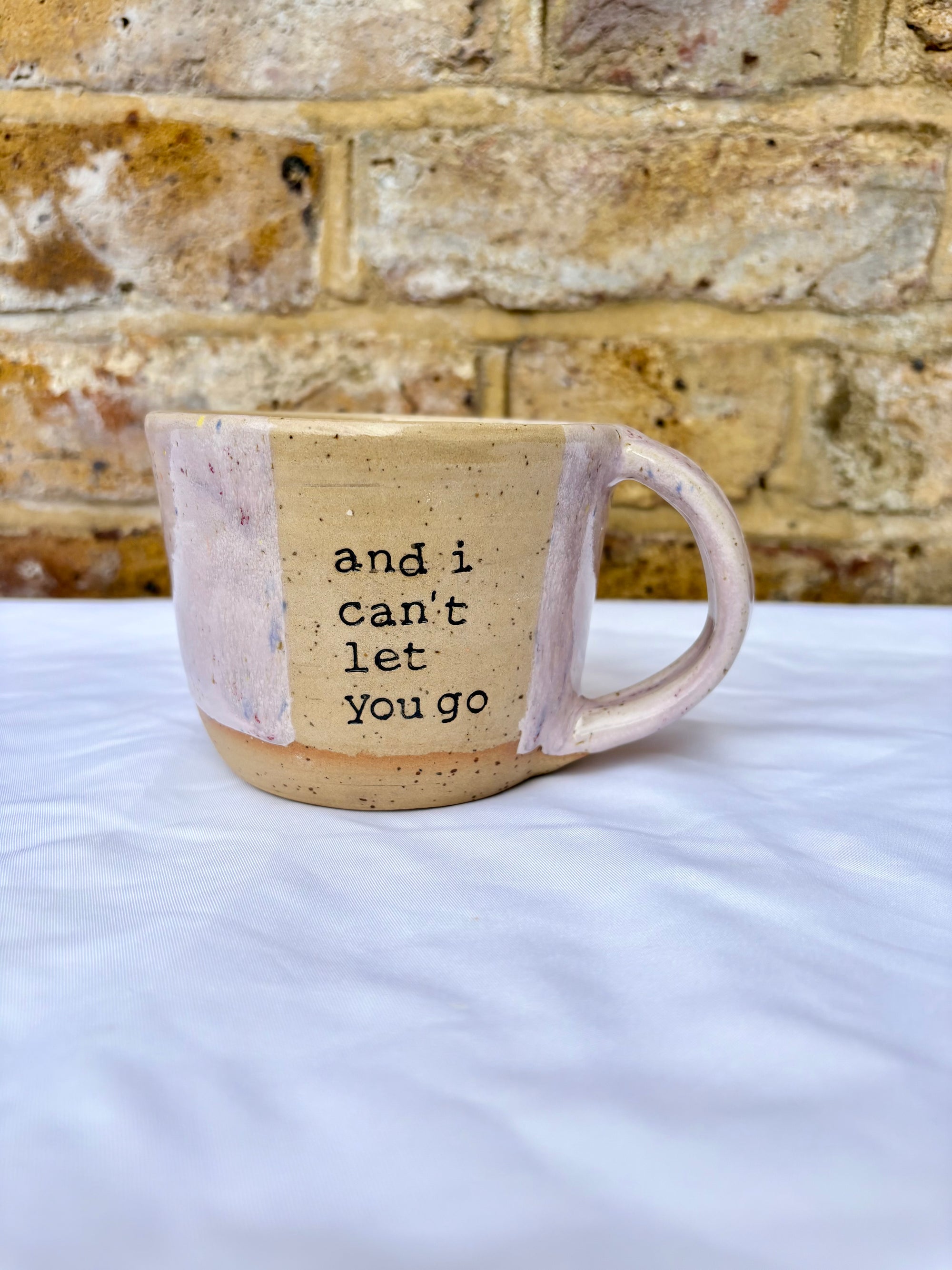 “and I can't let you go”, and "your handprint's on my soul" mug