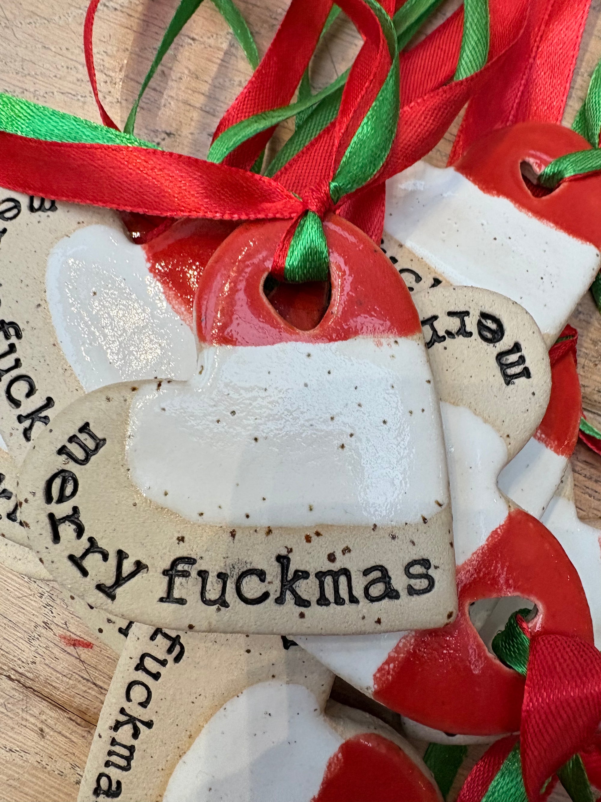 “merry fuckmas” hanging decoration (red and white, large)