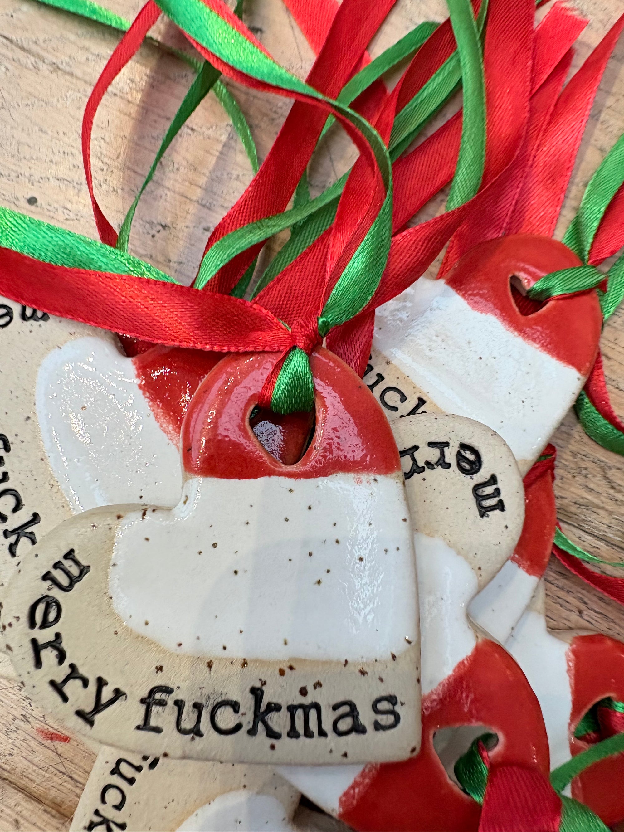 “merry fuckmas” hanging decoration (red and white, large)