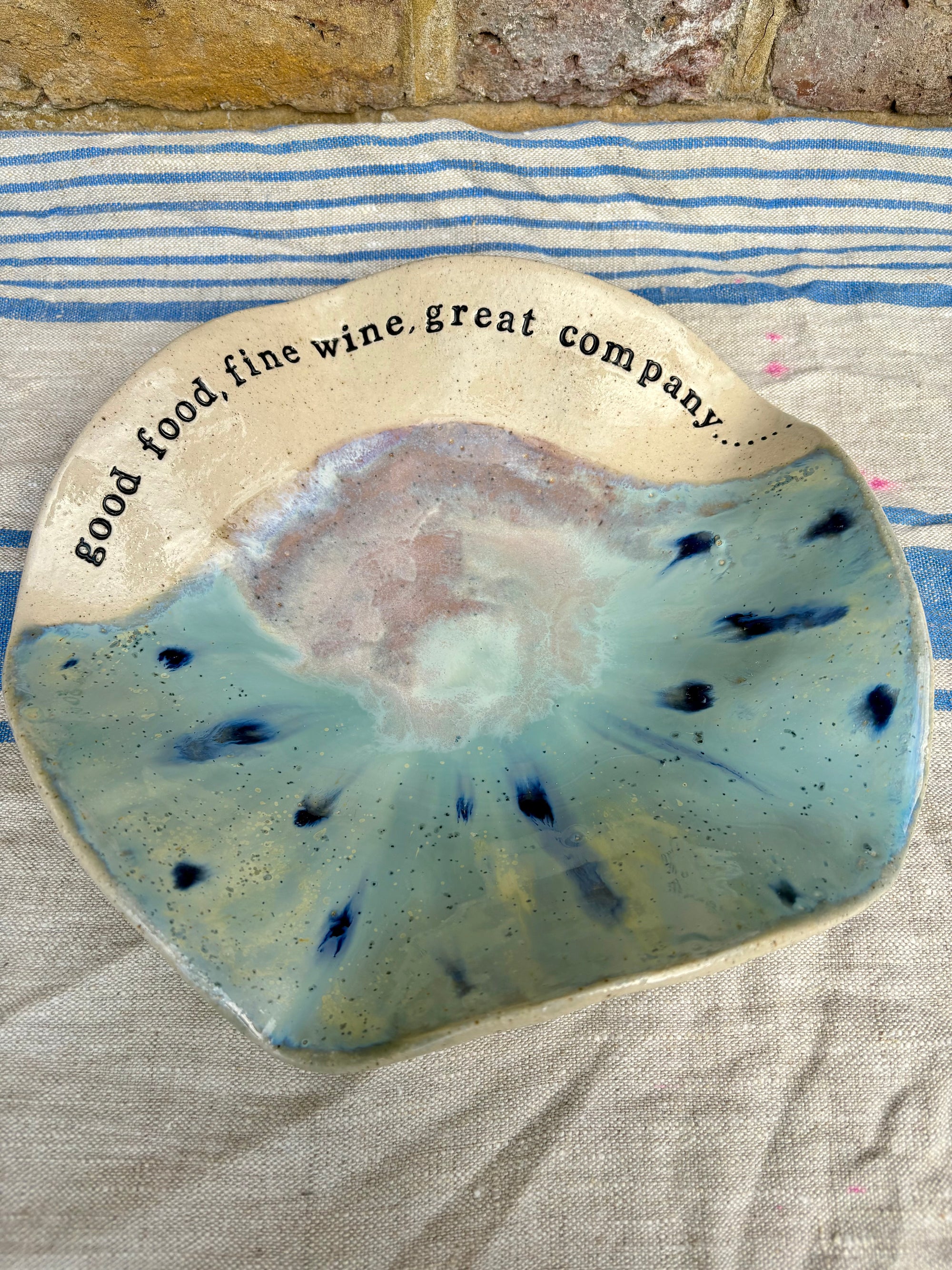 "good food, fine wine, great company..." serving dish