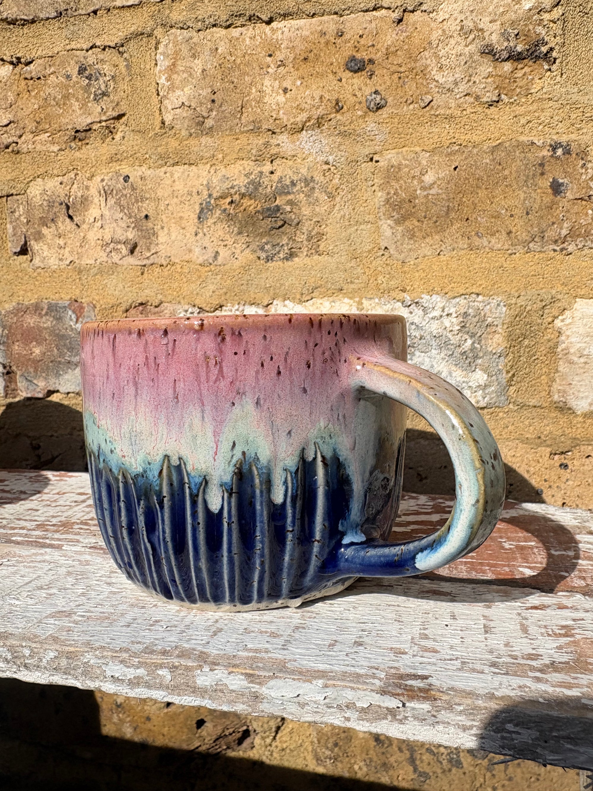 "please hesitate to reach out" mug (pink night sky)