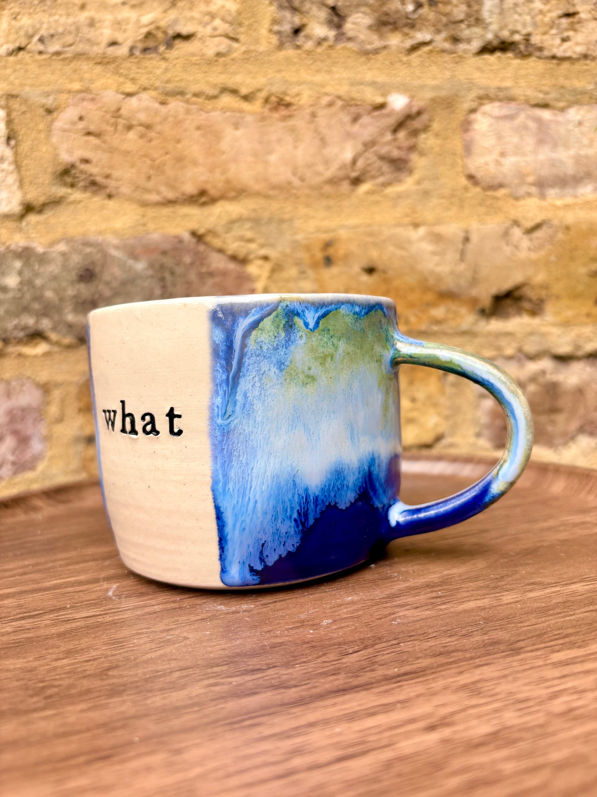 “What” “the fuck” mug (cream, blue/green)