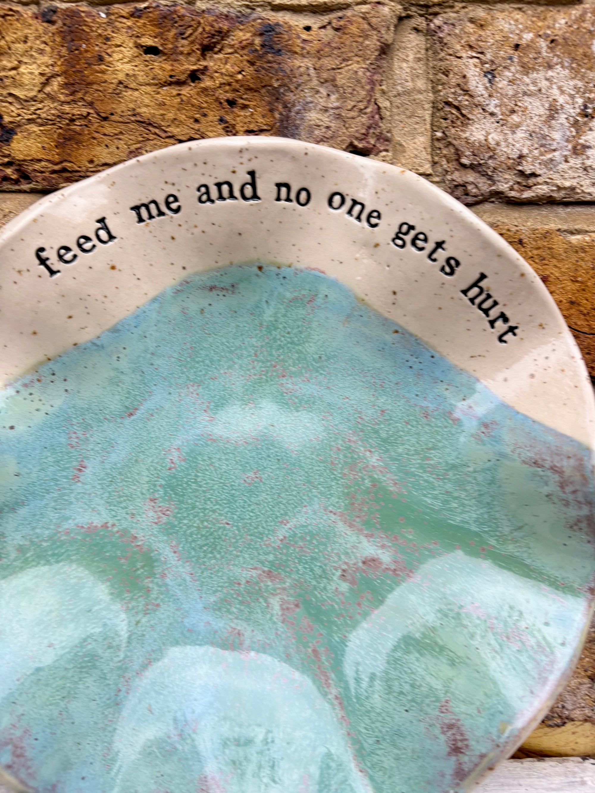 "feed me and no one gets hurt"  serving dish
