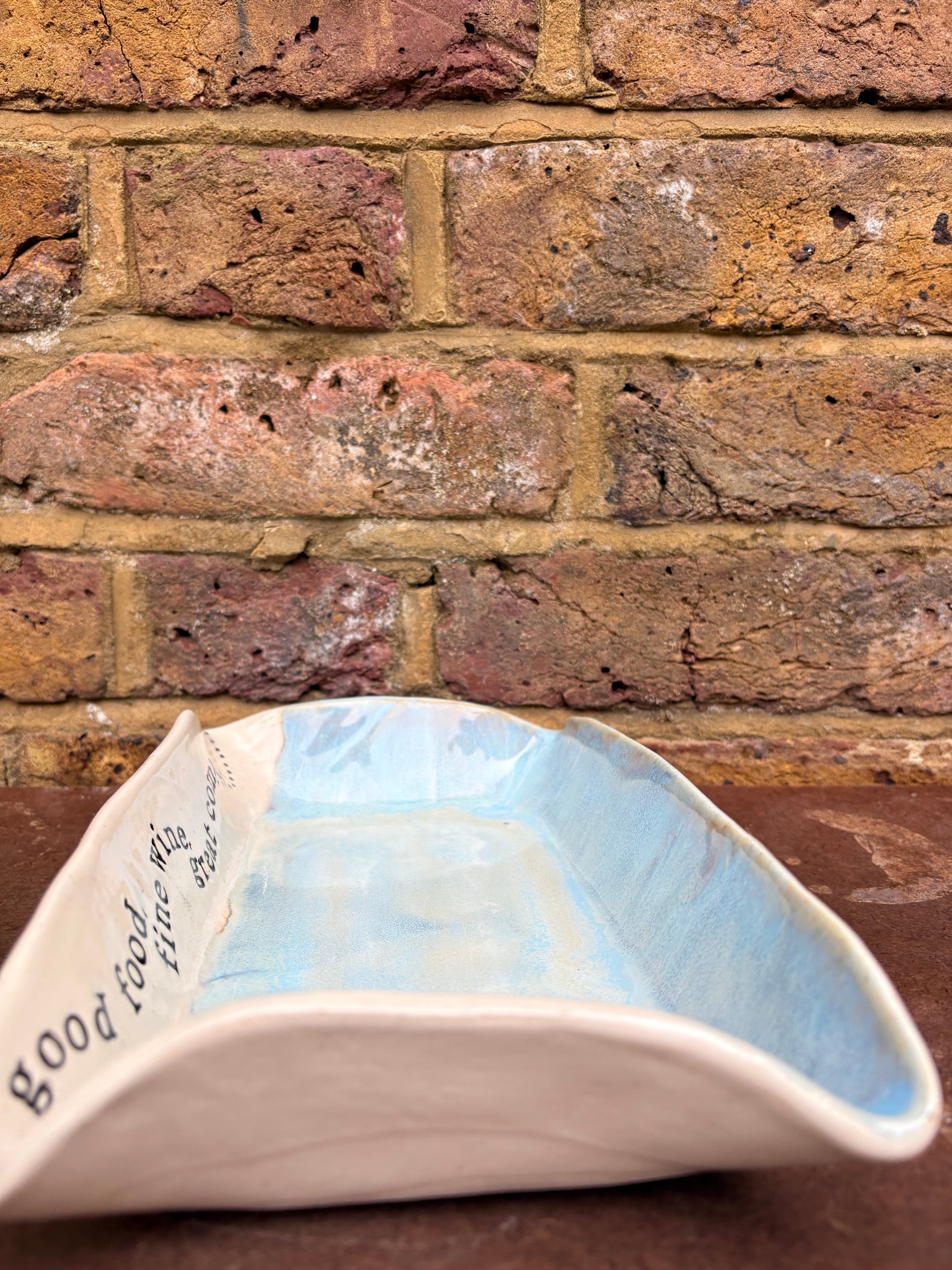 “good food, fine wine, great company..." rectangular salad/serving dish