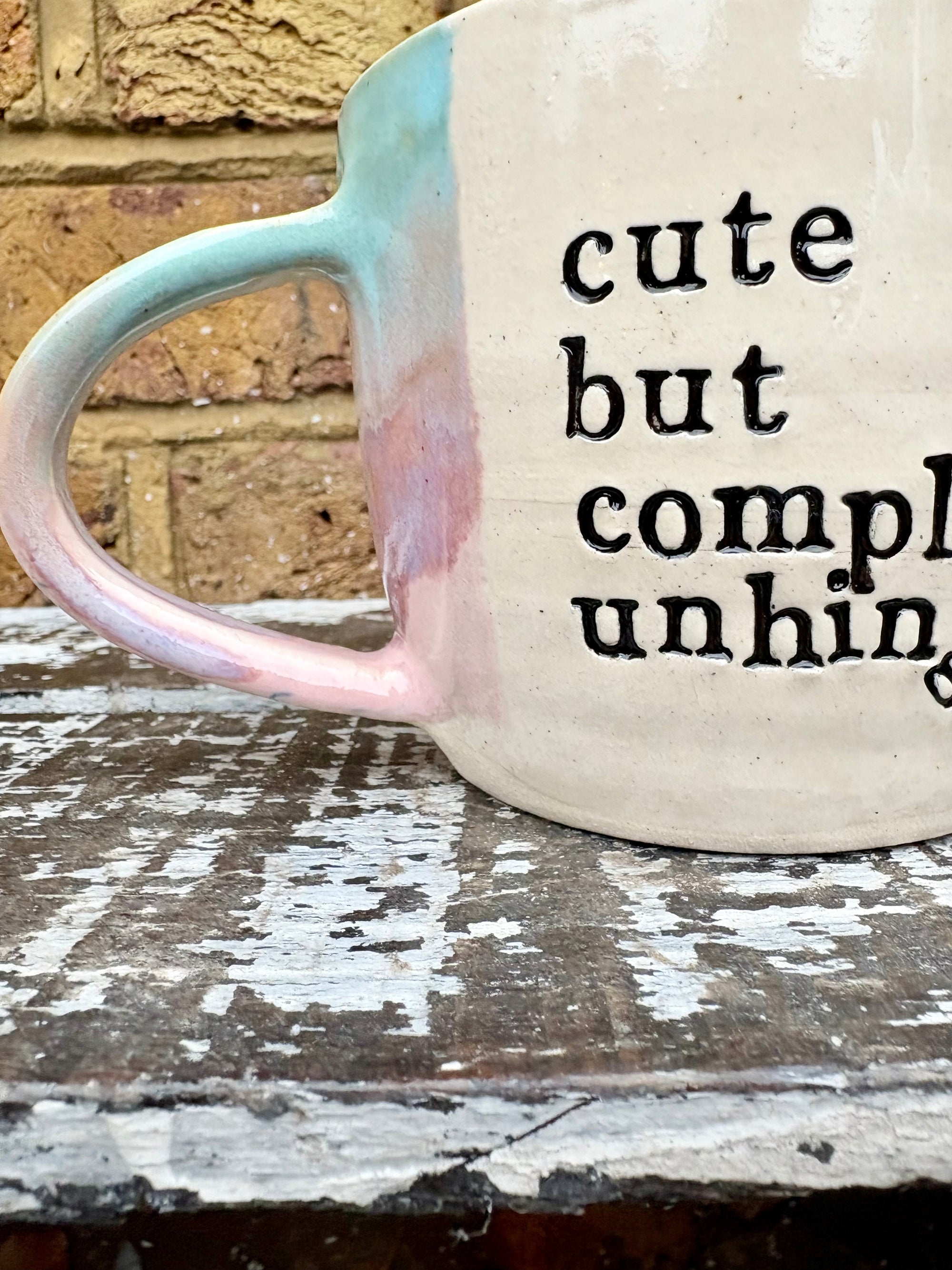 "cute but completely unhinged" mug