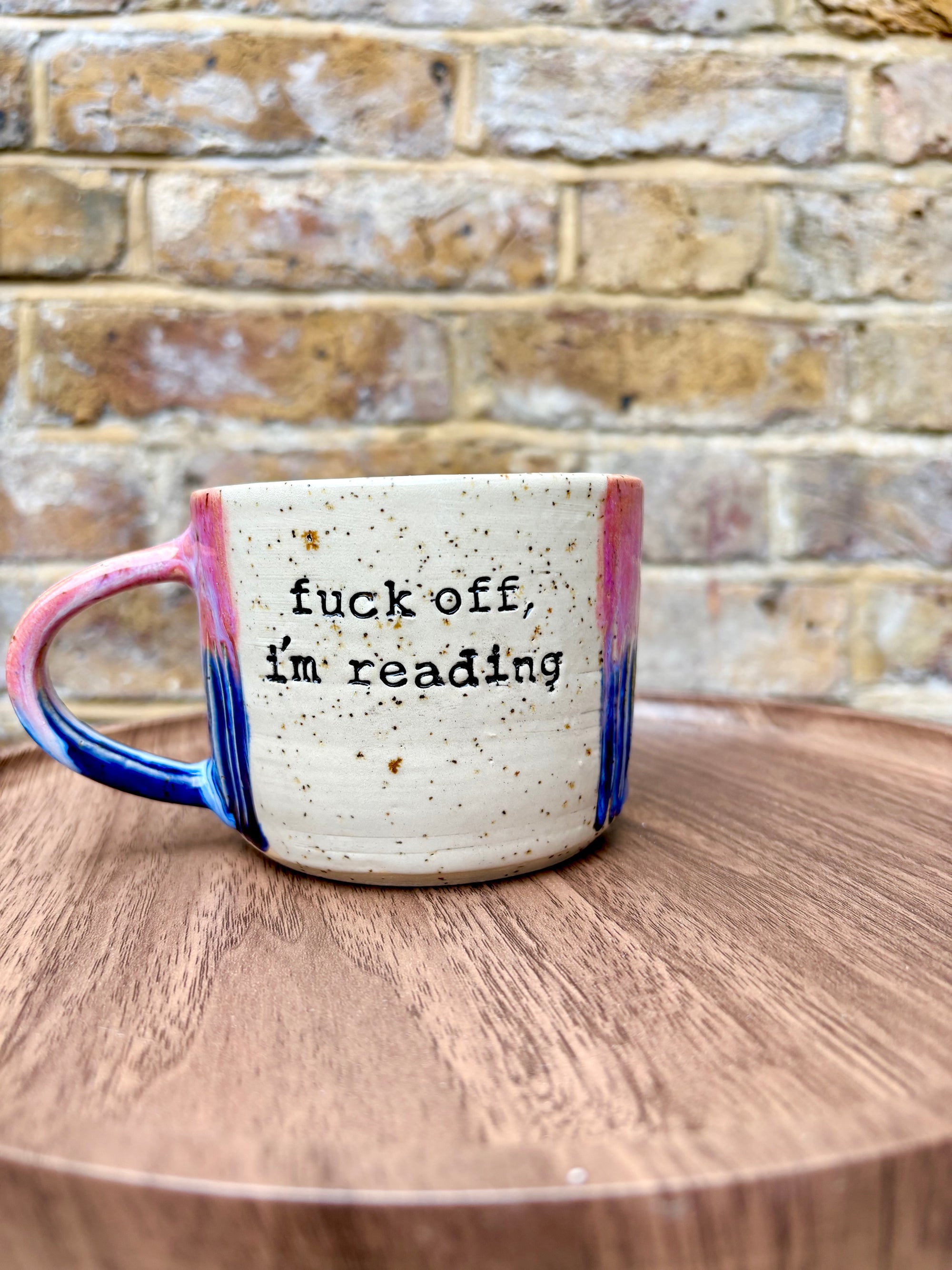 “Fuck off i'm reading" mug (Pink/blue/flecked)