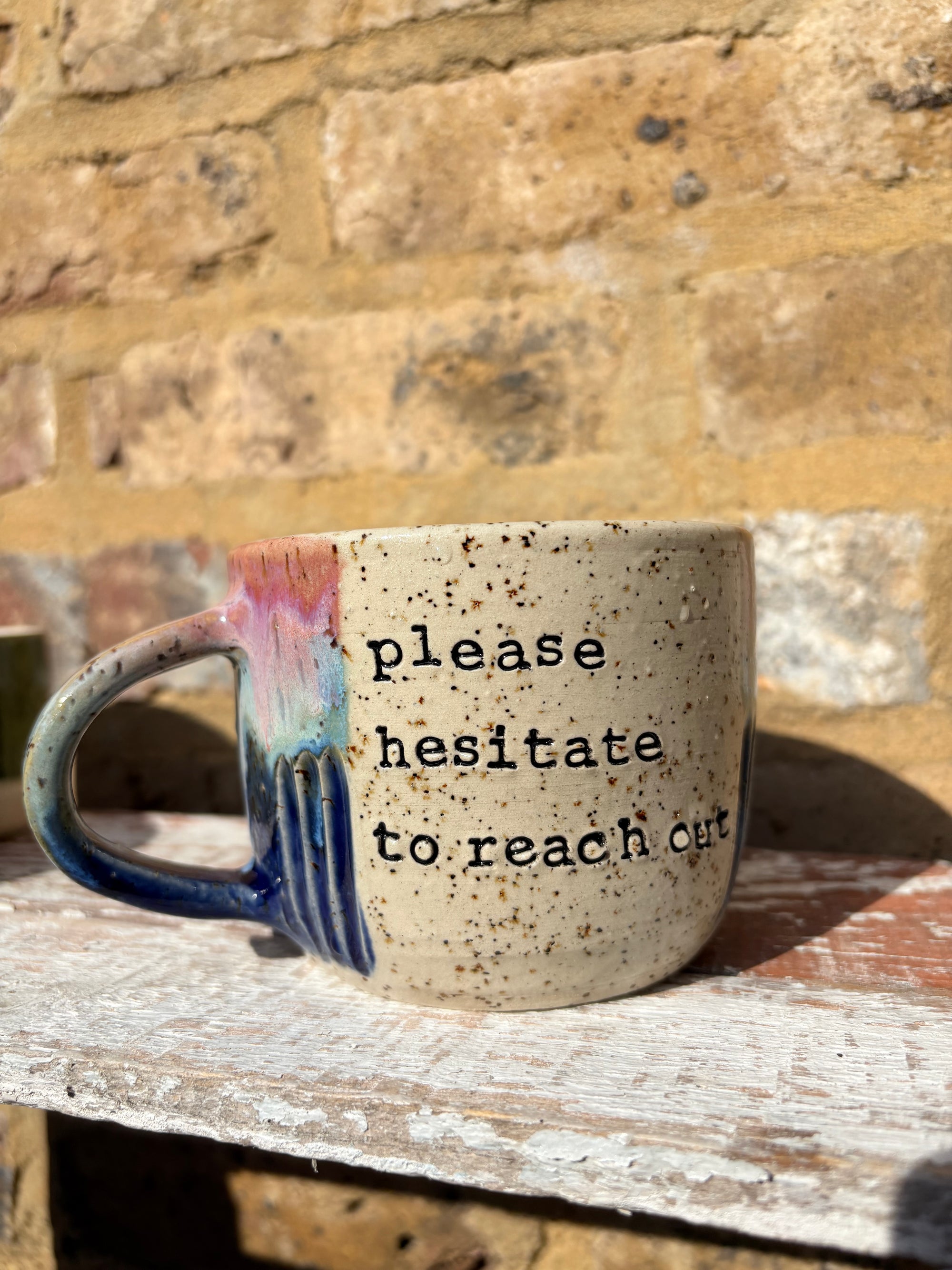 "please hesitate to reach out" mug (pink night sky)