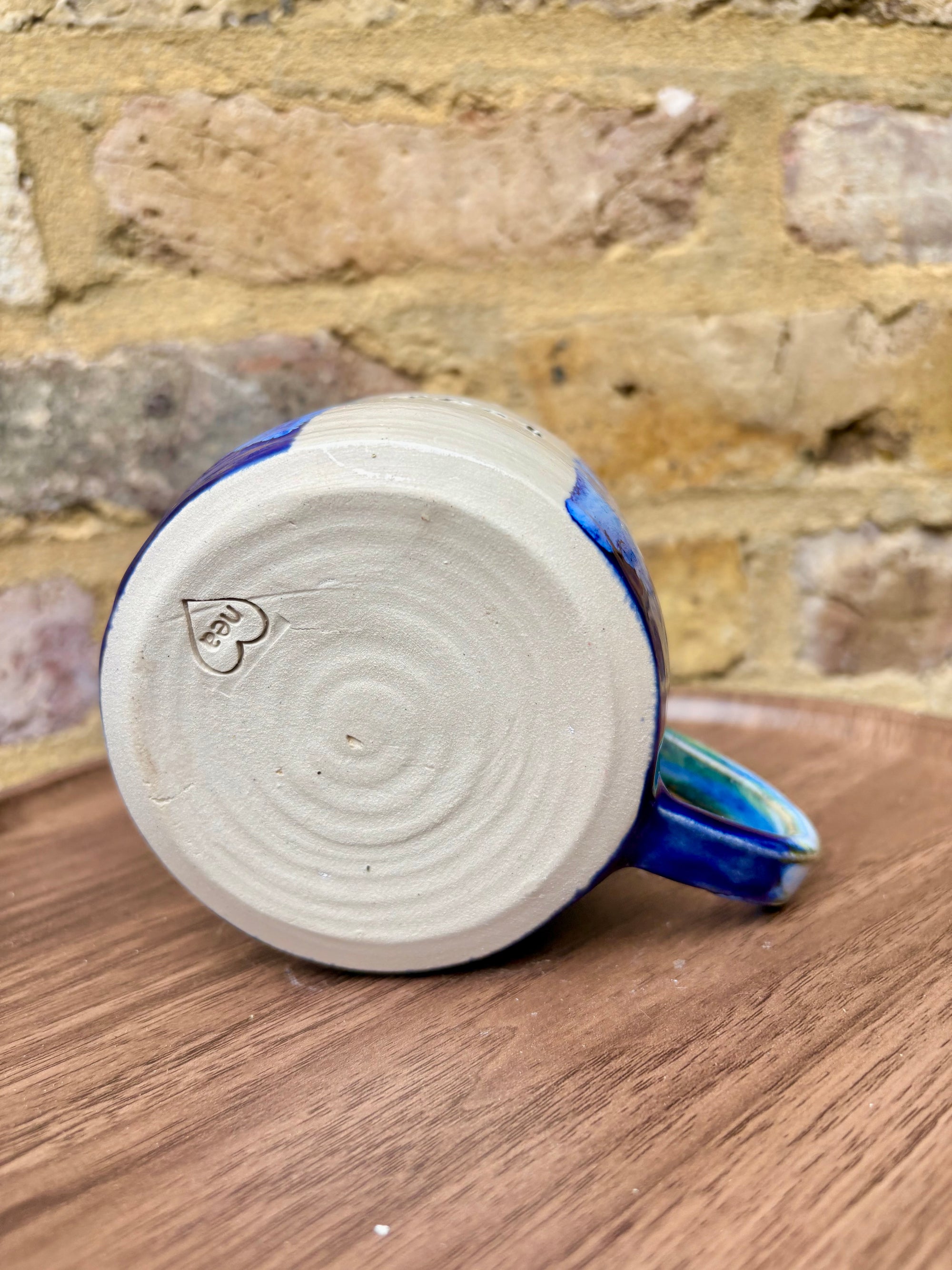 “What” “the fuck” mug (cream, blue/green)
