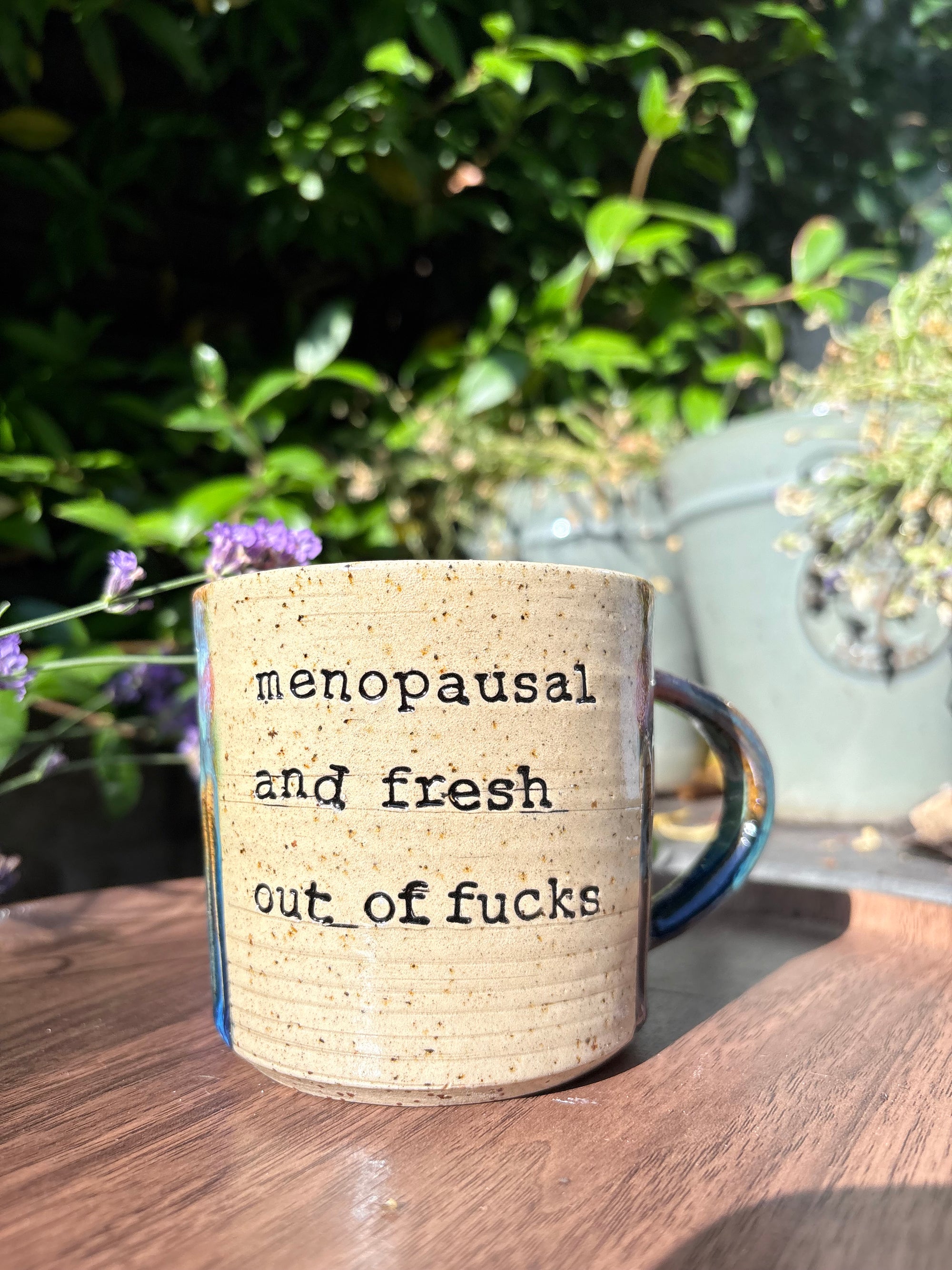 "menopausal and fresh out of fucks" mug (green/blue)