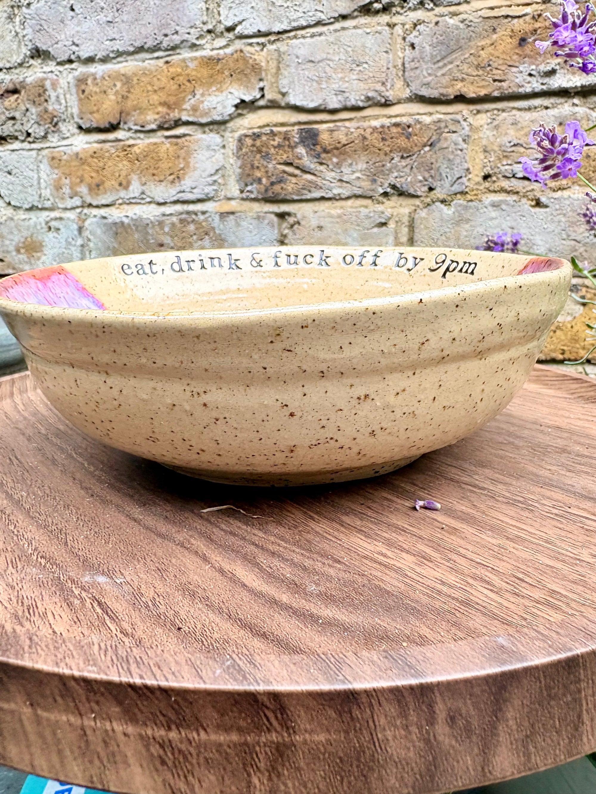 “eat, drink and fuck off by 9pm"  deep round salad/pasta bowl (pink, dark flecked clay)