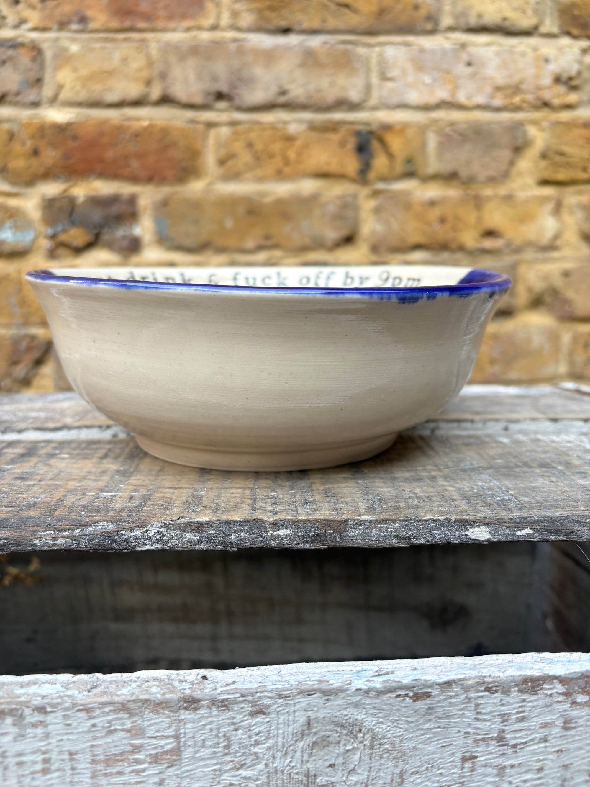 “eat, drink and fuck off by 9pm"  deep round salad/pasta bowl (pink night sky)