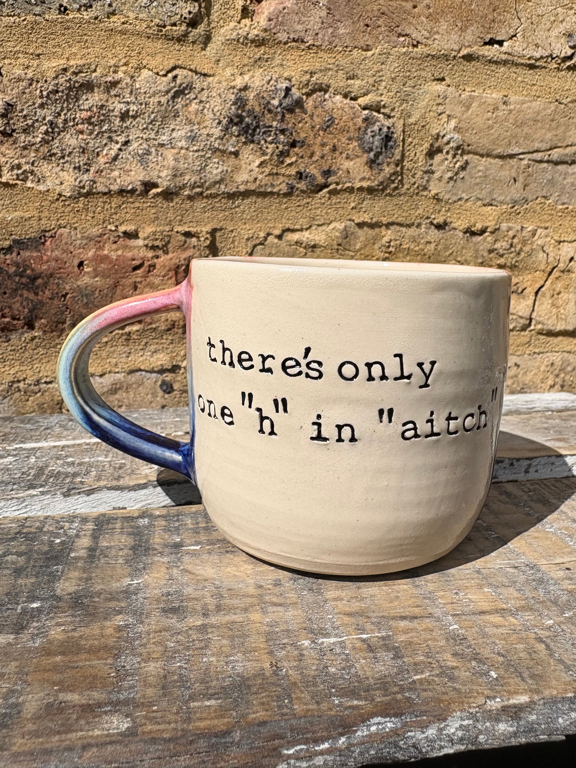 "there's only one "h" in "aitch" mug (pink night sky)