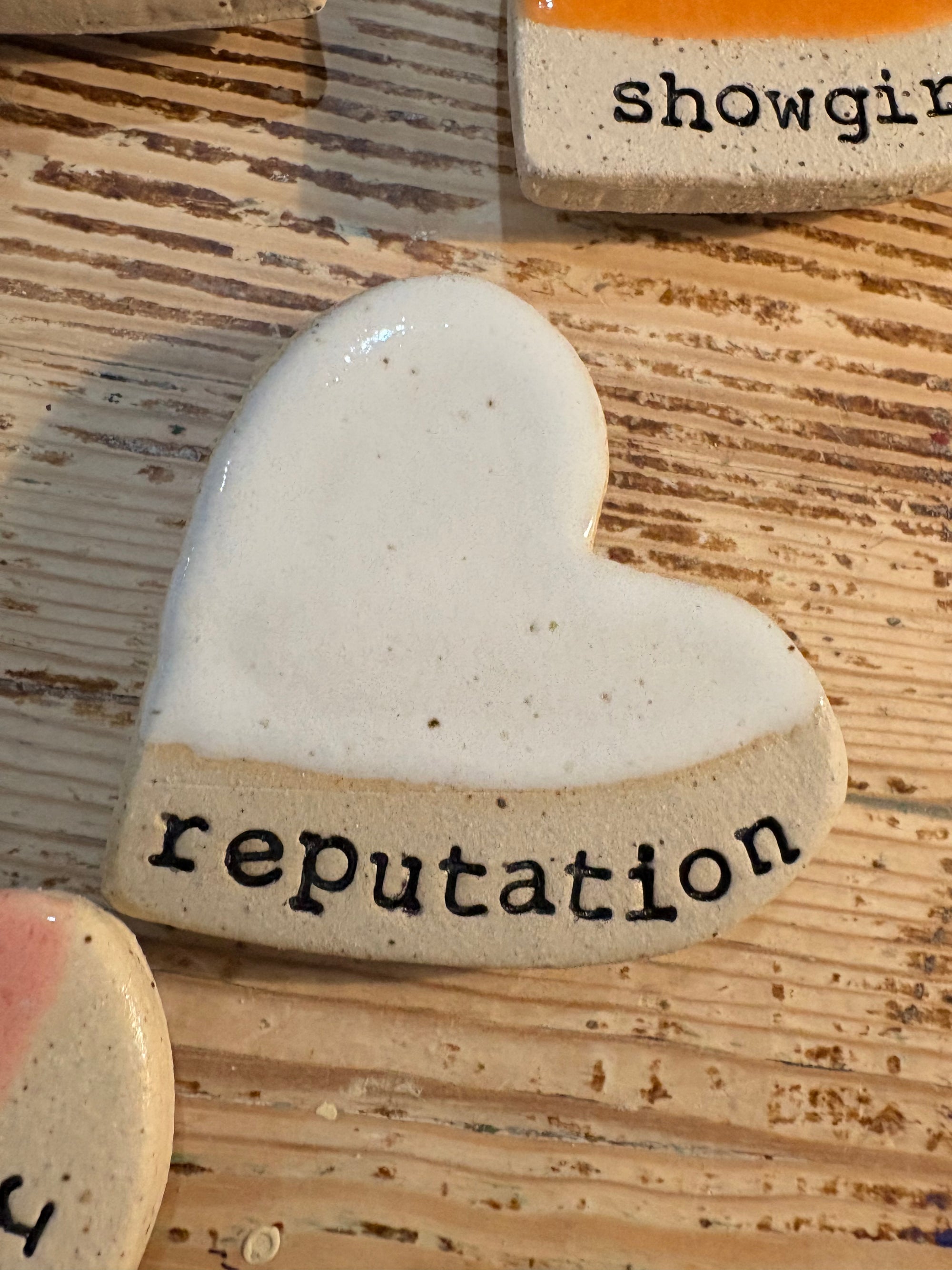 Twelve heart shaped Taylor Swift album magnets