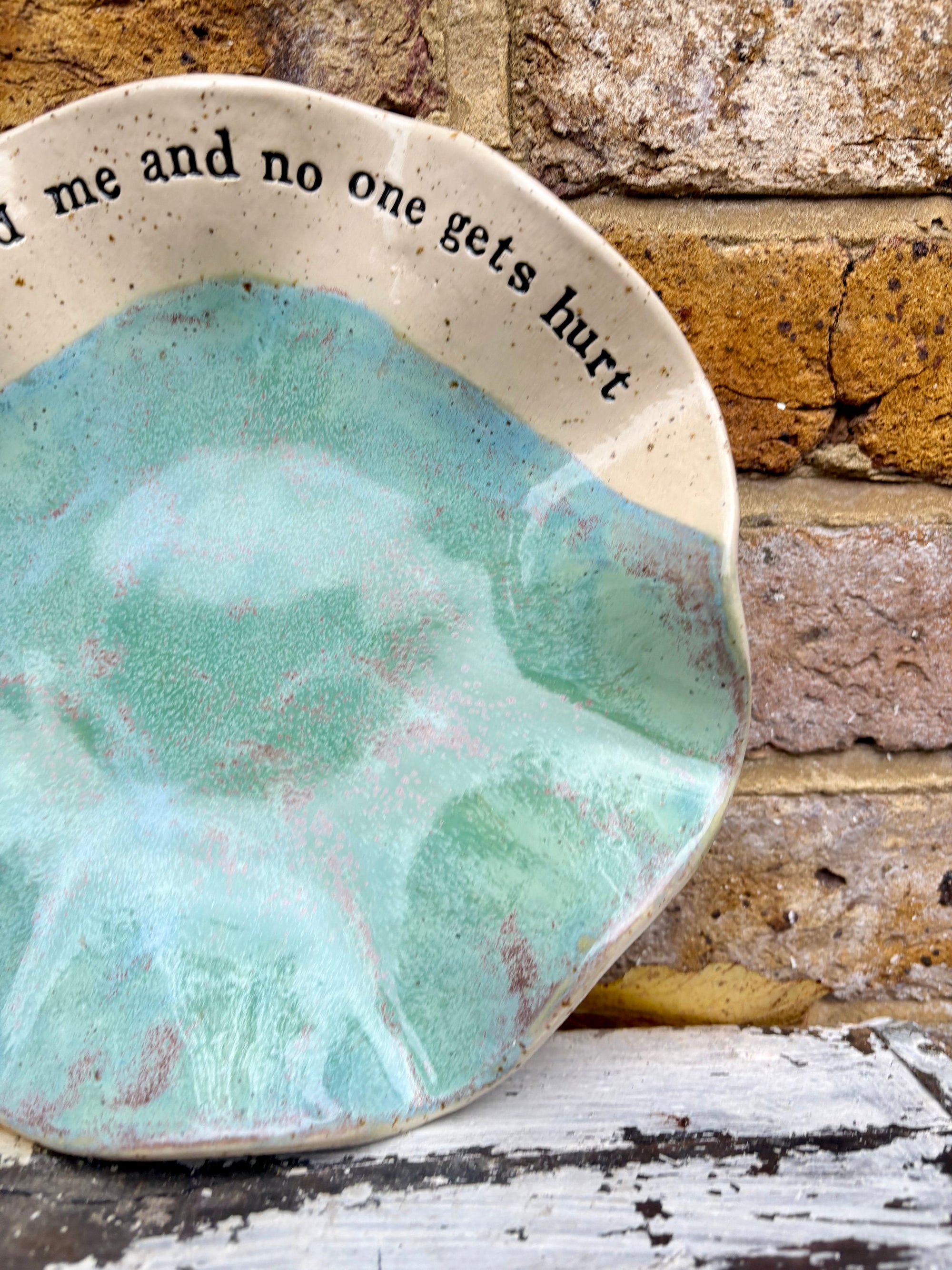 "feed me and no one gets hurt"  serving dish