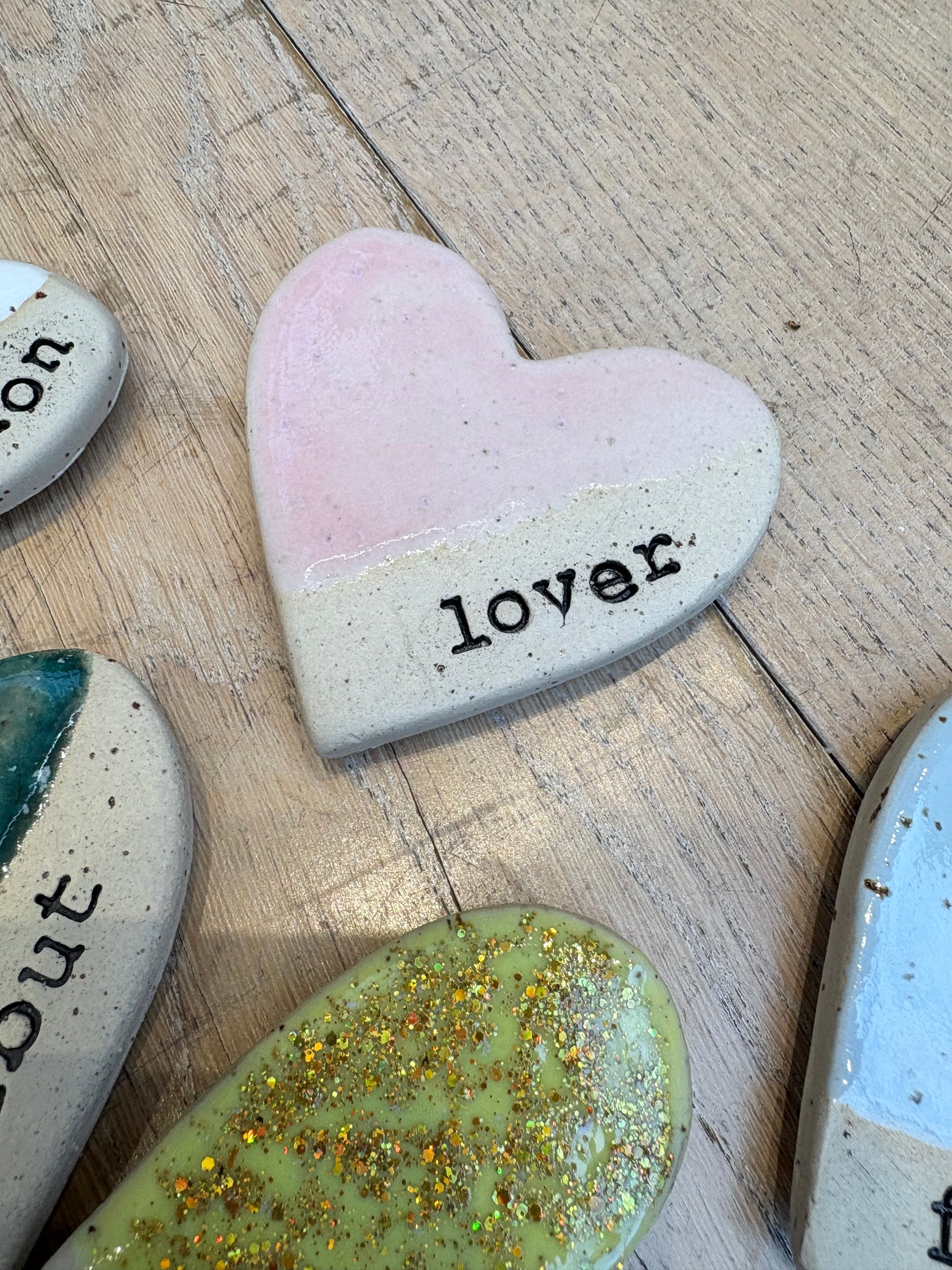 Twelve heart shaped Taylor Swift album magnets
