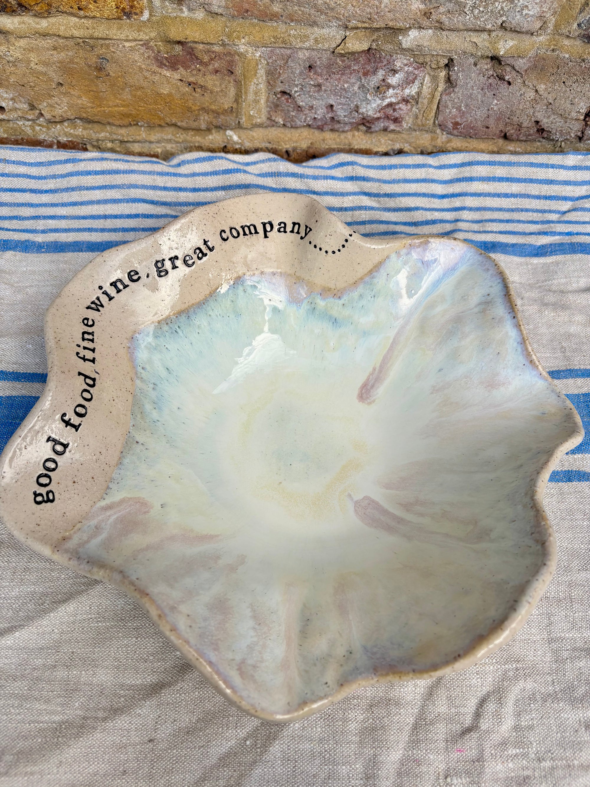 "good food, fine wine, great company..." serving dish