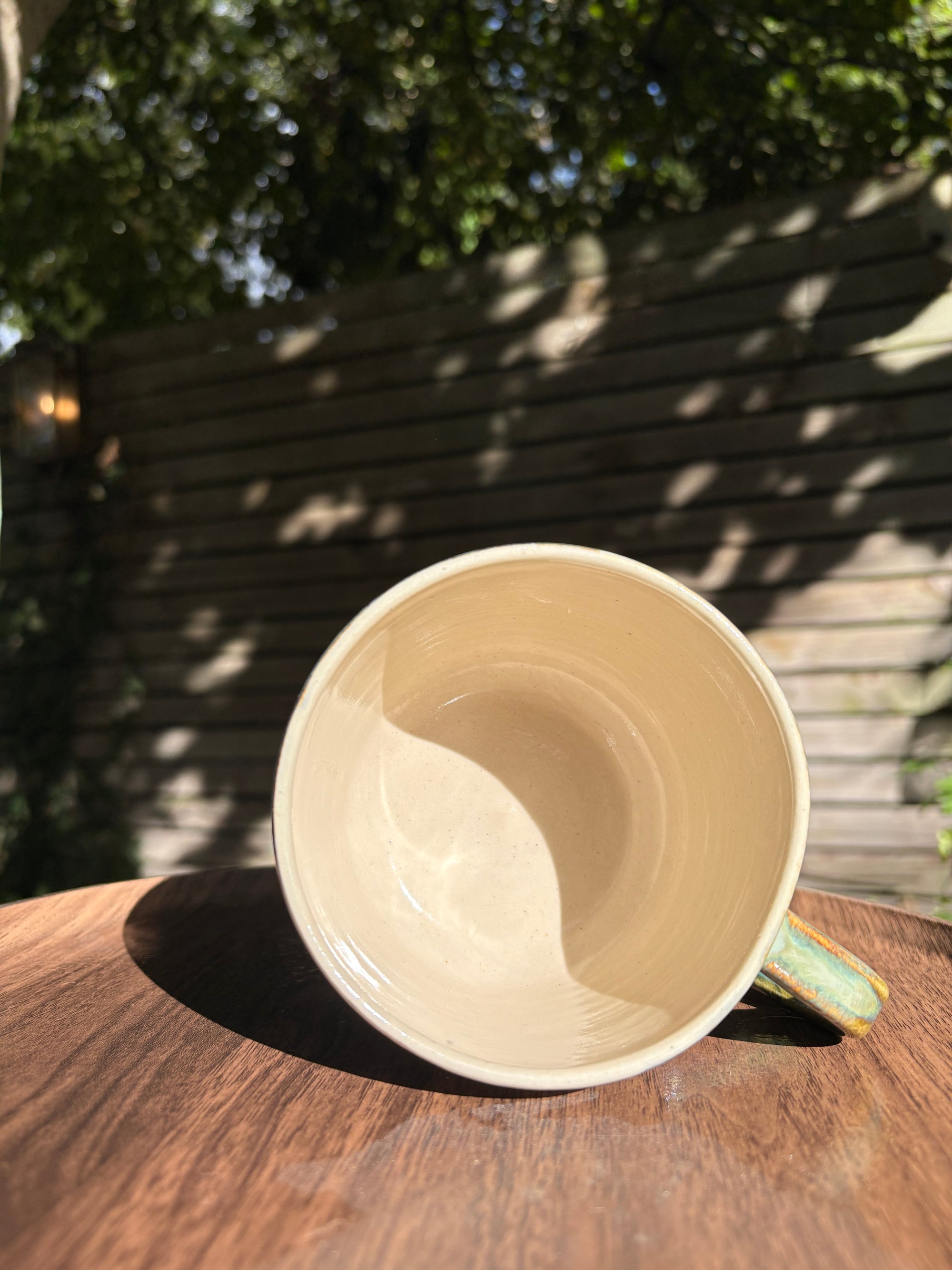 "what a fucked up time to be alive" mug (green/blue)