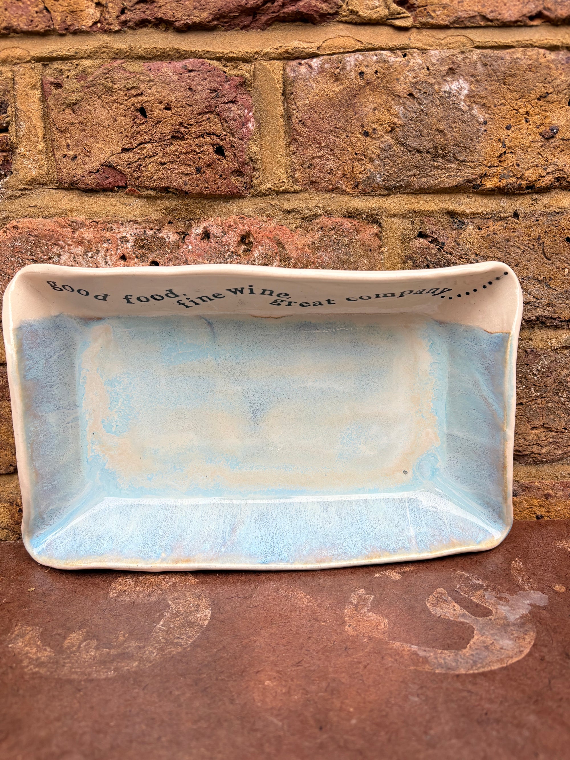 “good food, fine wine, great company..." rectangular salad/serving dish