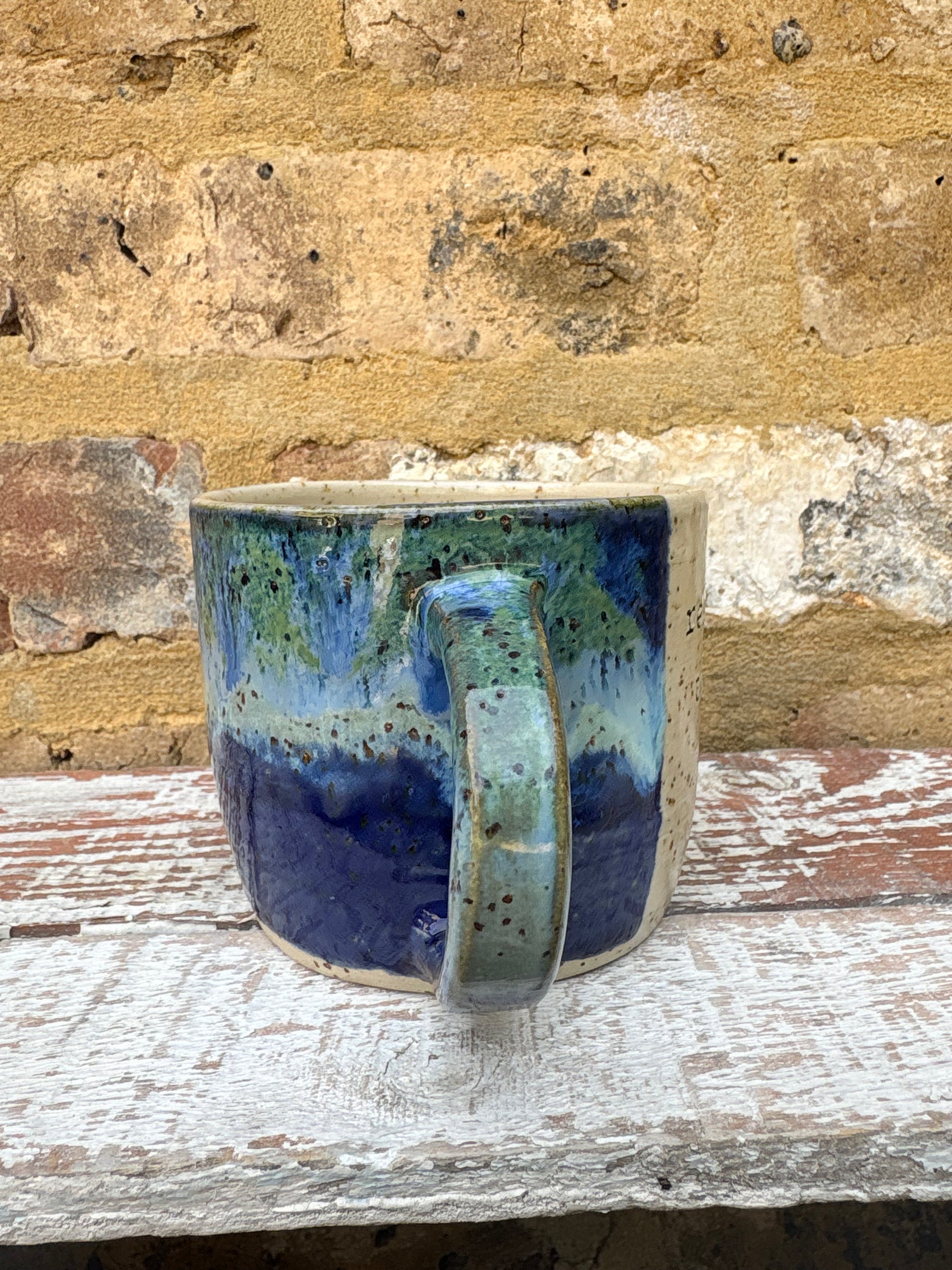 "really happy to be here” "what a bunch of cunts" mug (blue/green)