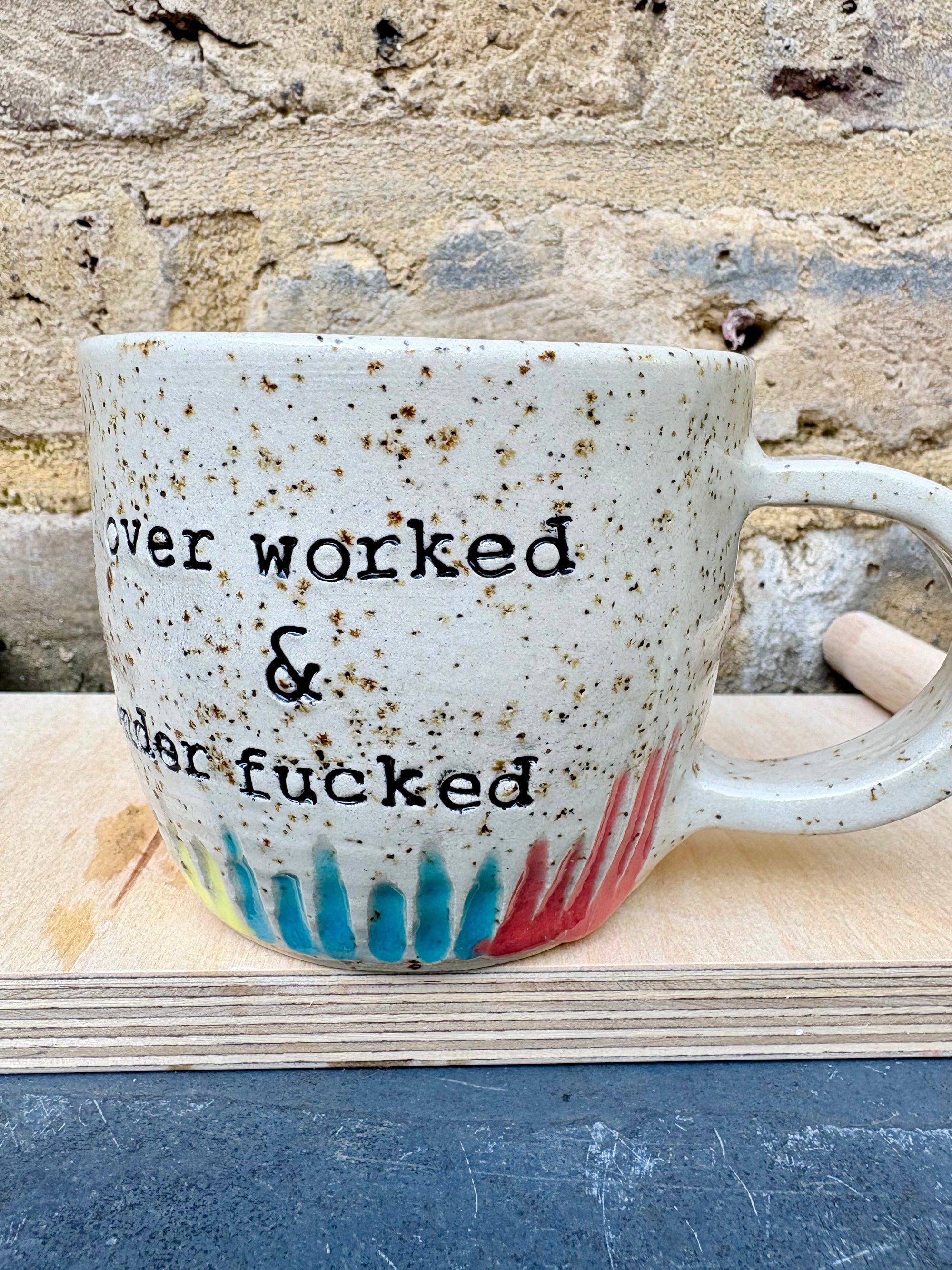 overworked and underfucked mug (multicoloured rainbow grooves)