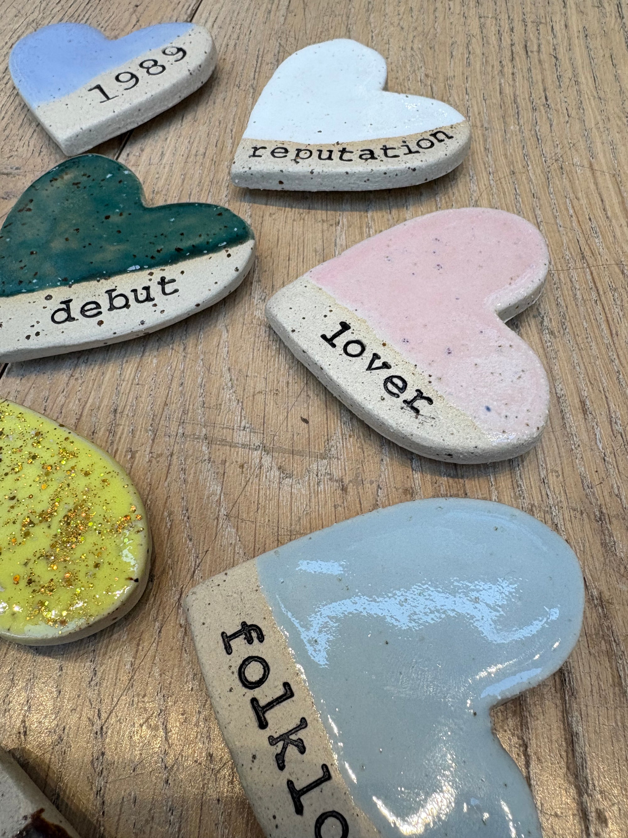 Twelve heart shaped Taylor Swift album magnets