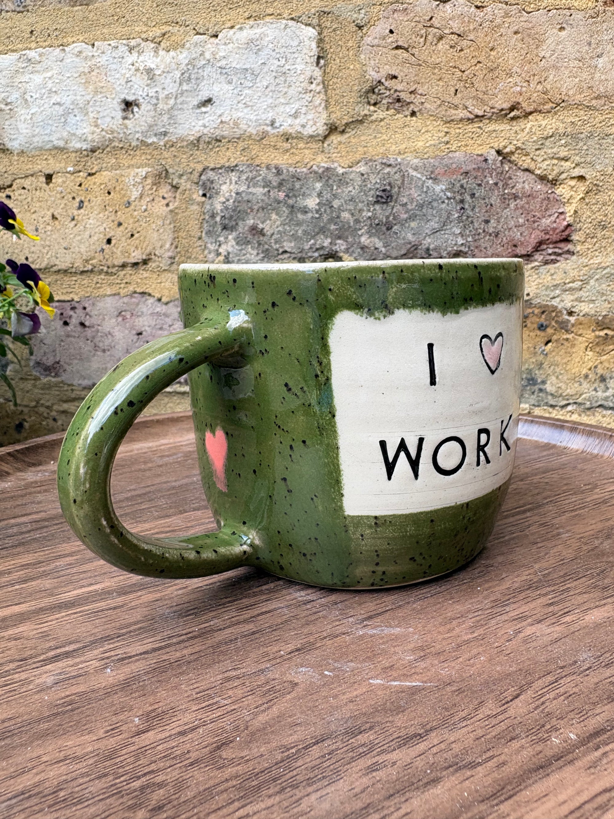 "I 🩷 WORK” "everyone in this place is a cunt" mug (green, right hander, pink hearts)