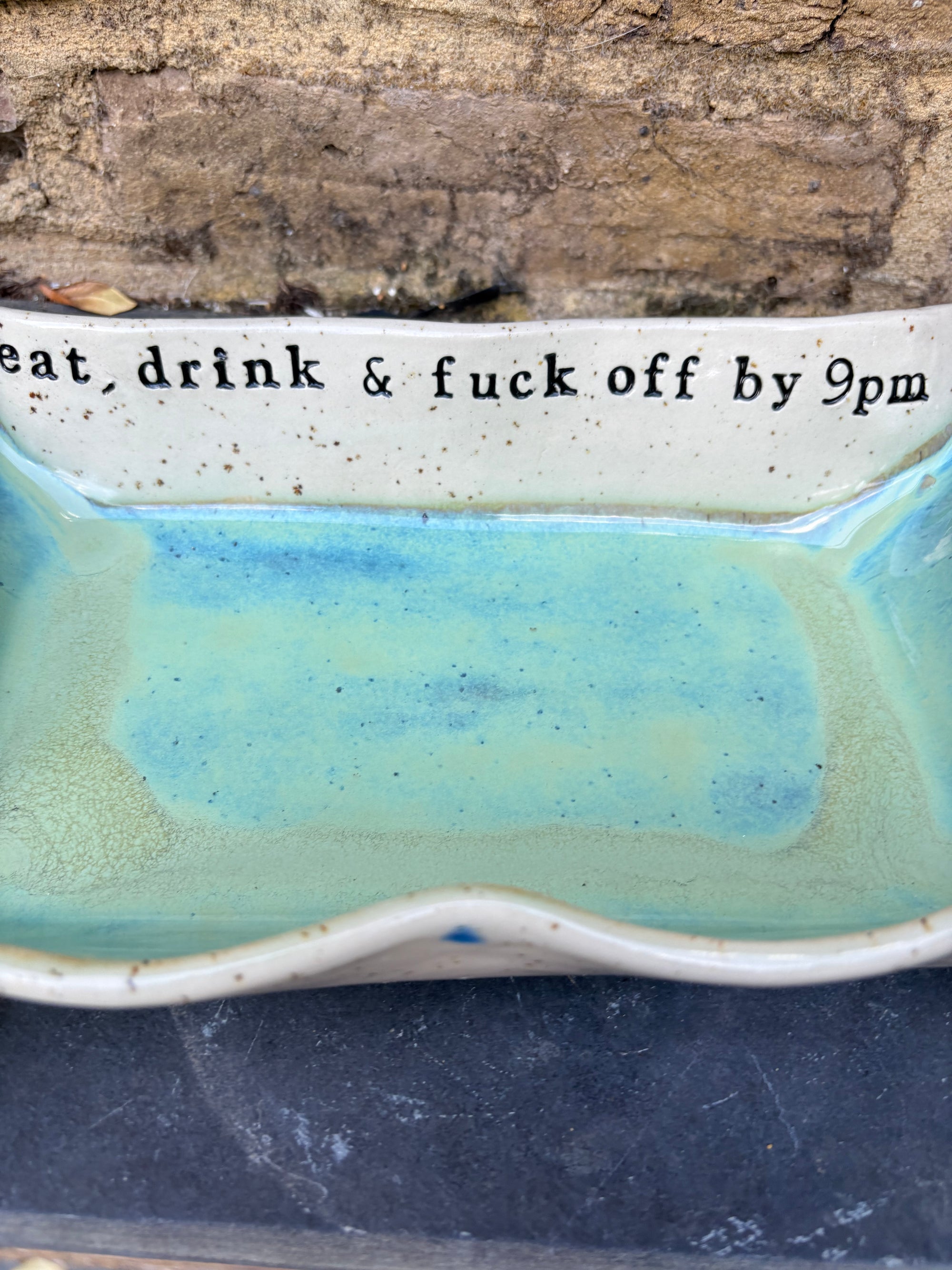 “eat, drink and fuck off by 9pm" rectangular dish (green, flecked clay)