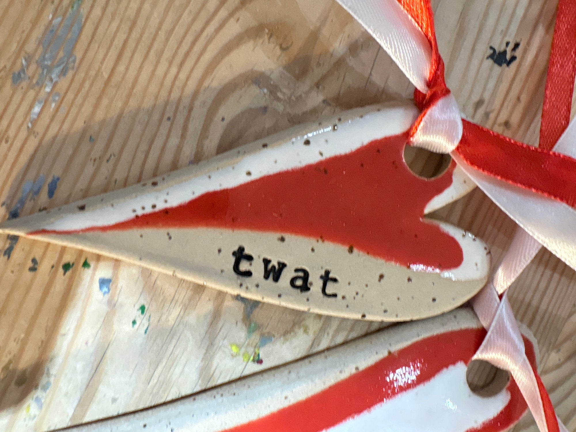 “twat” hanging decoration (red and white, large)