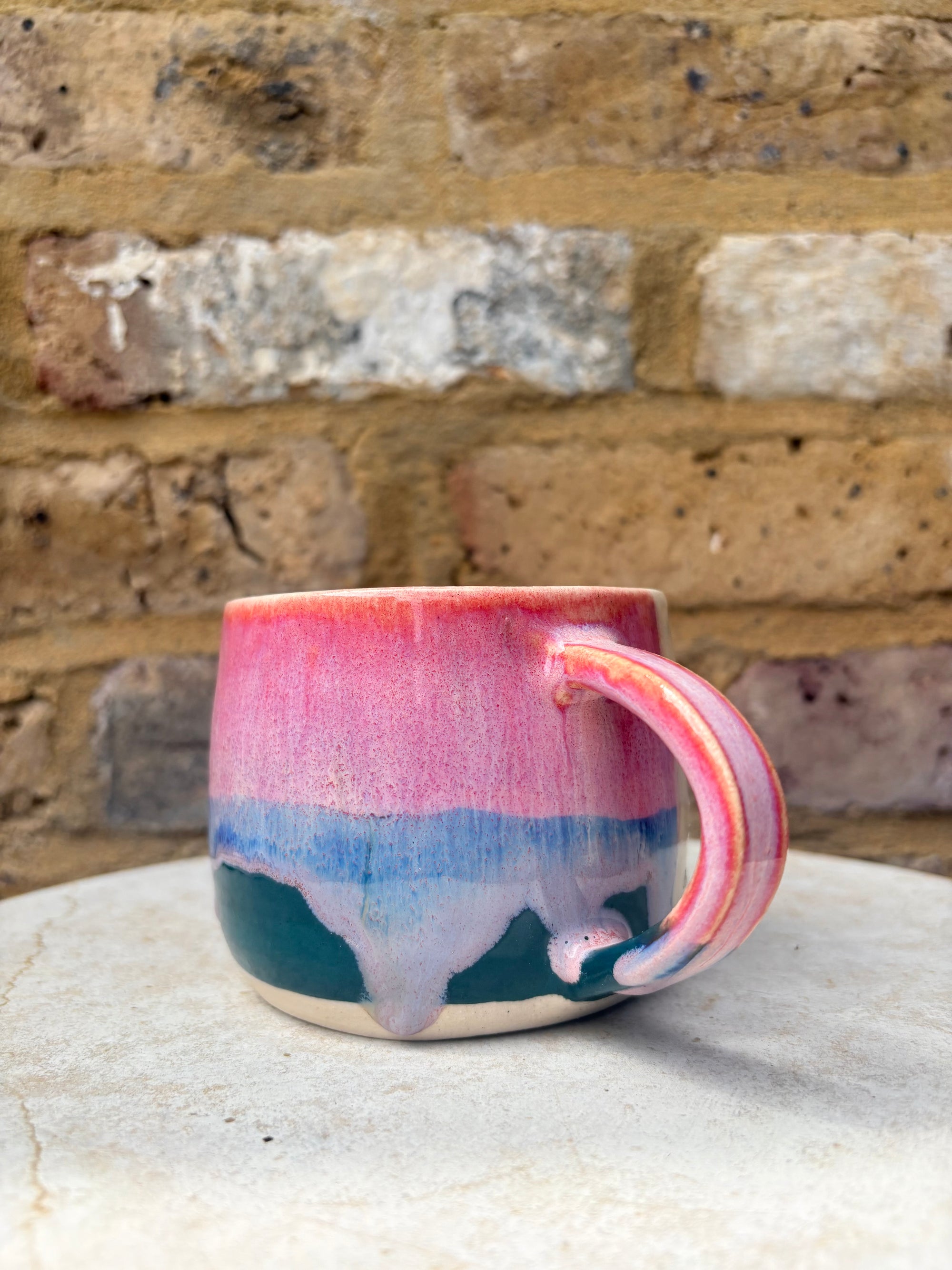 "please hesitate to reach out to me" mug (pink/green)