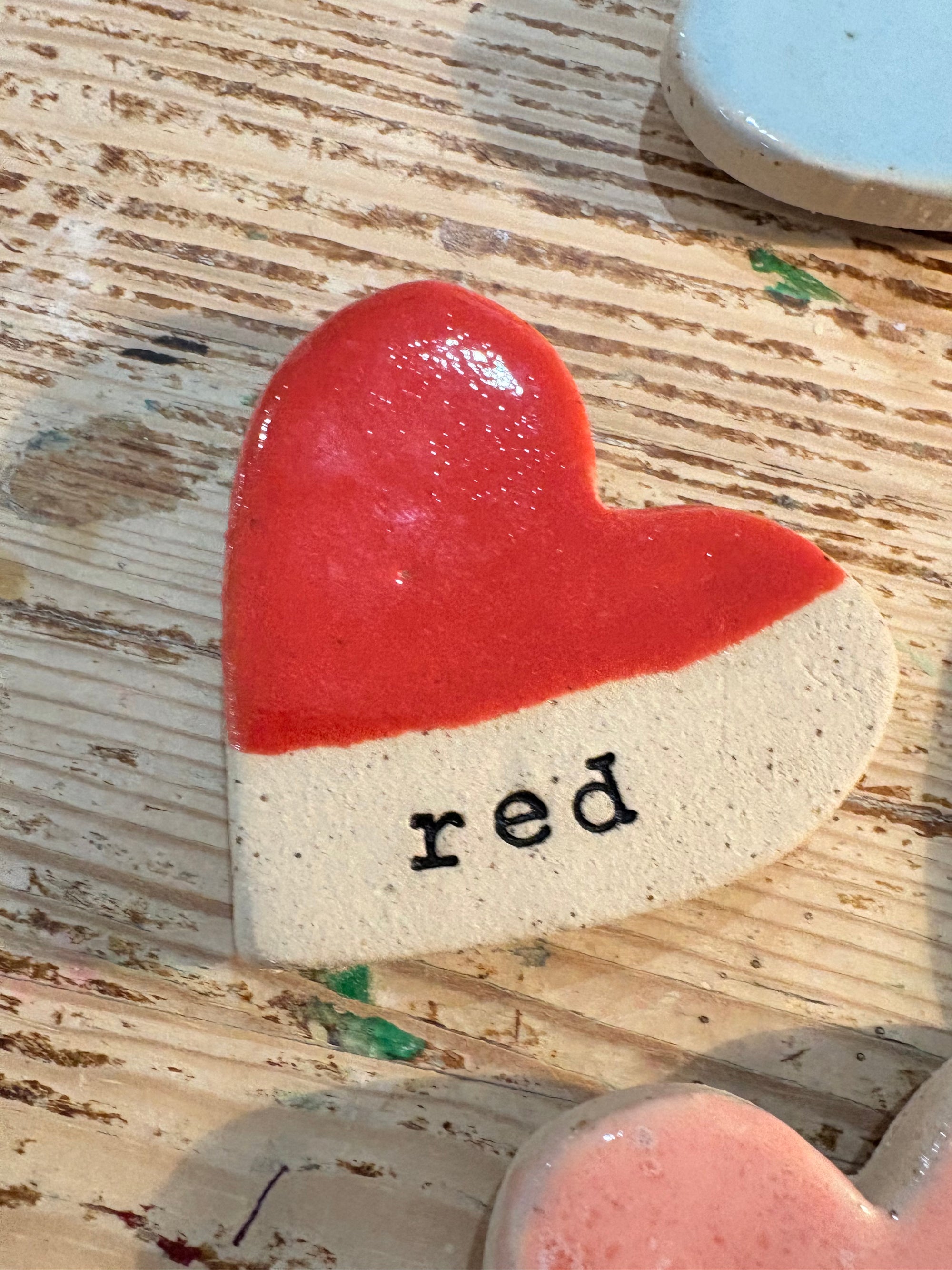 Twelve heart shaped Taylor Swift album magnets