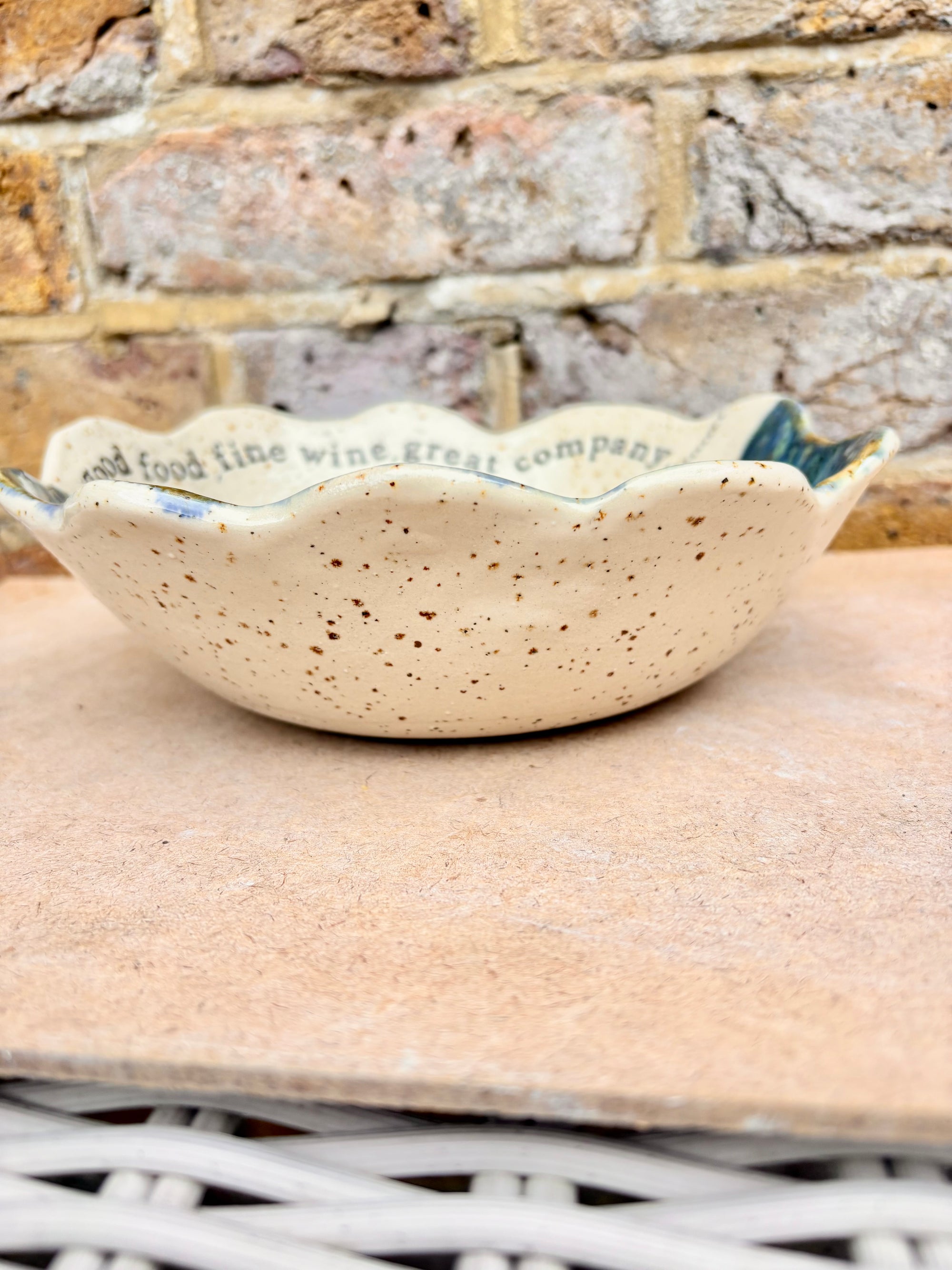 "good food, fine wine, great company..." deep salad/serving dish