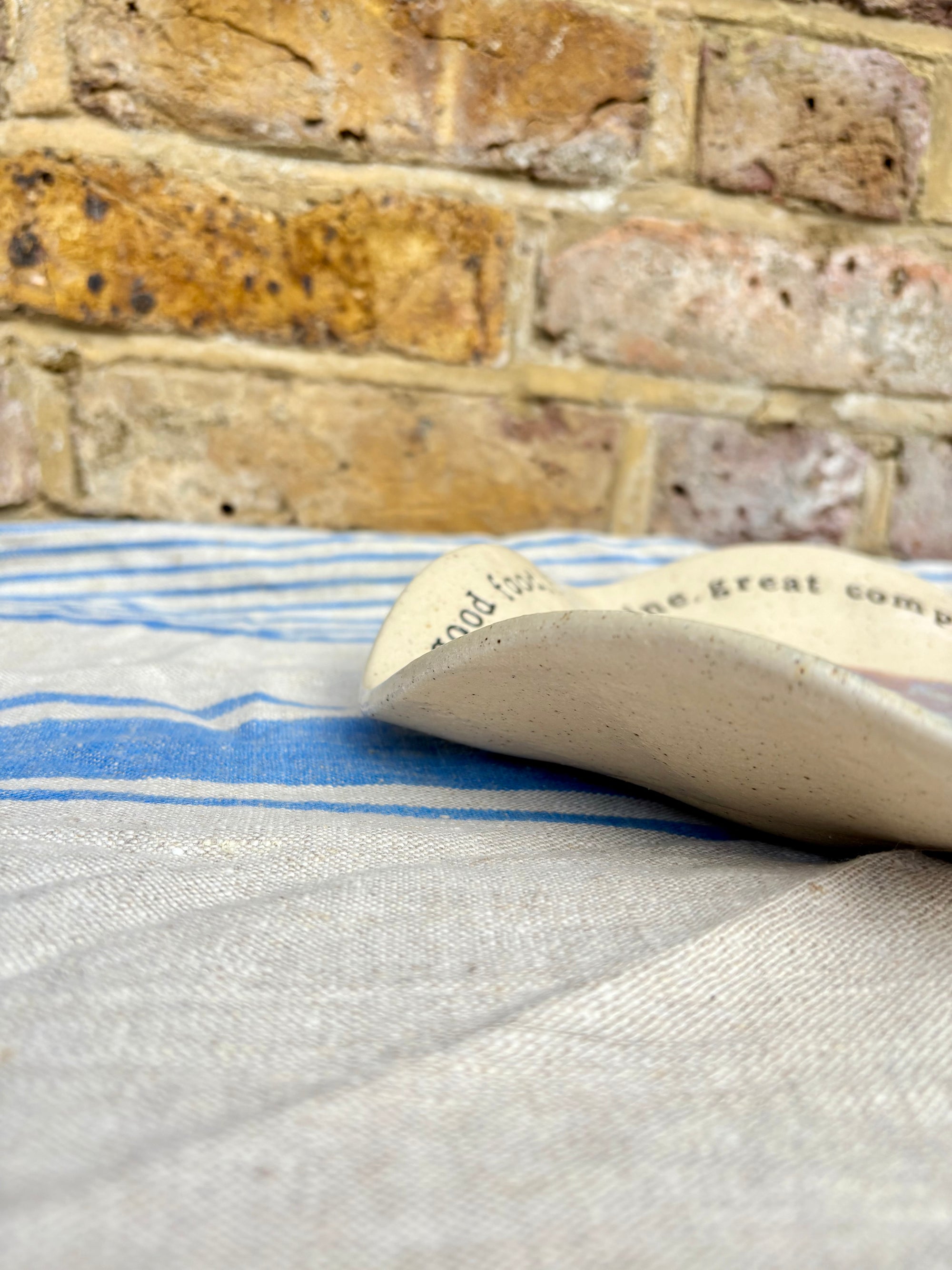 "good food, fine wine, great company..." serving dish