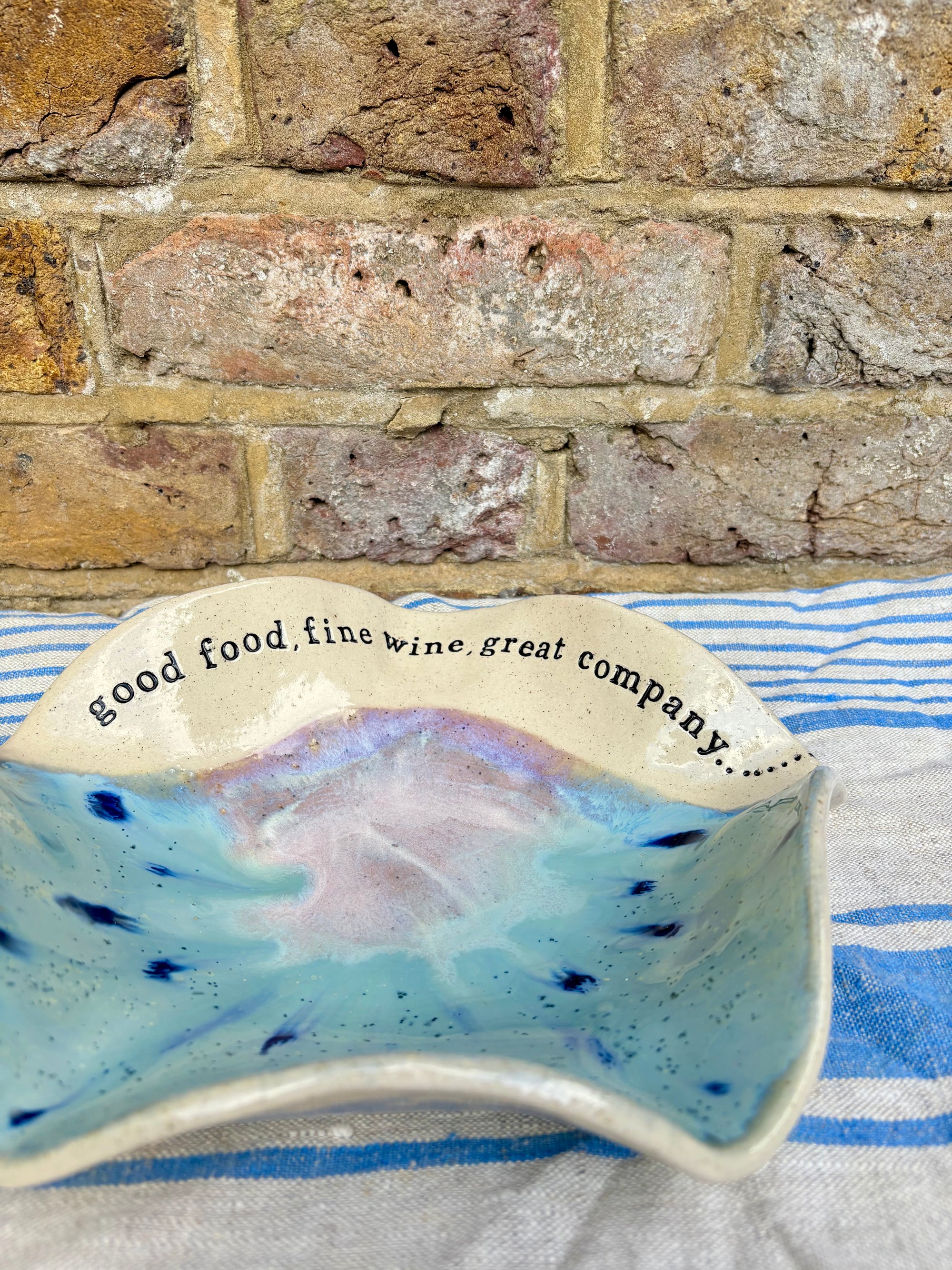 "good food, fine wine, great company..." serving dish