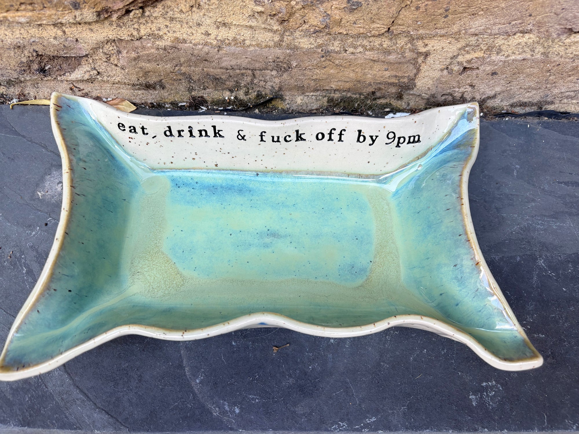 “eat, drink and fuck off by 9pm" rectangular dish (green, flecked clay)