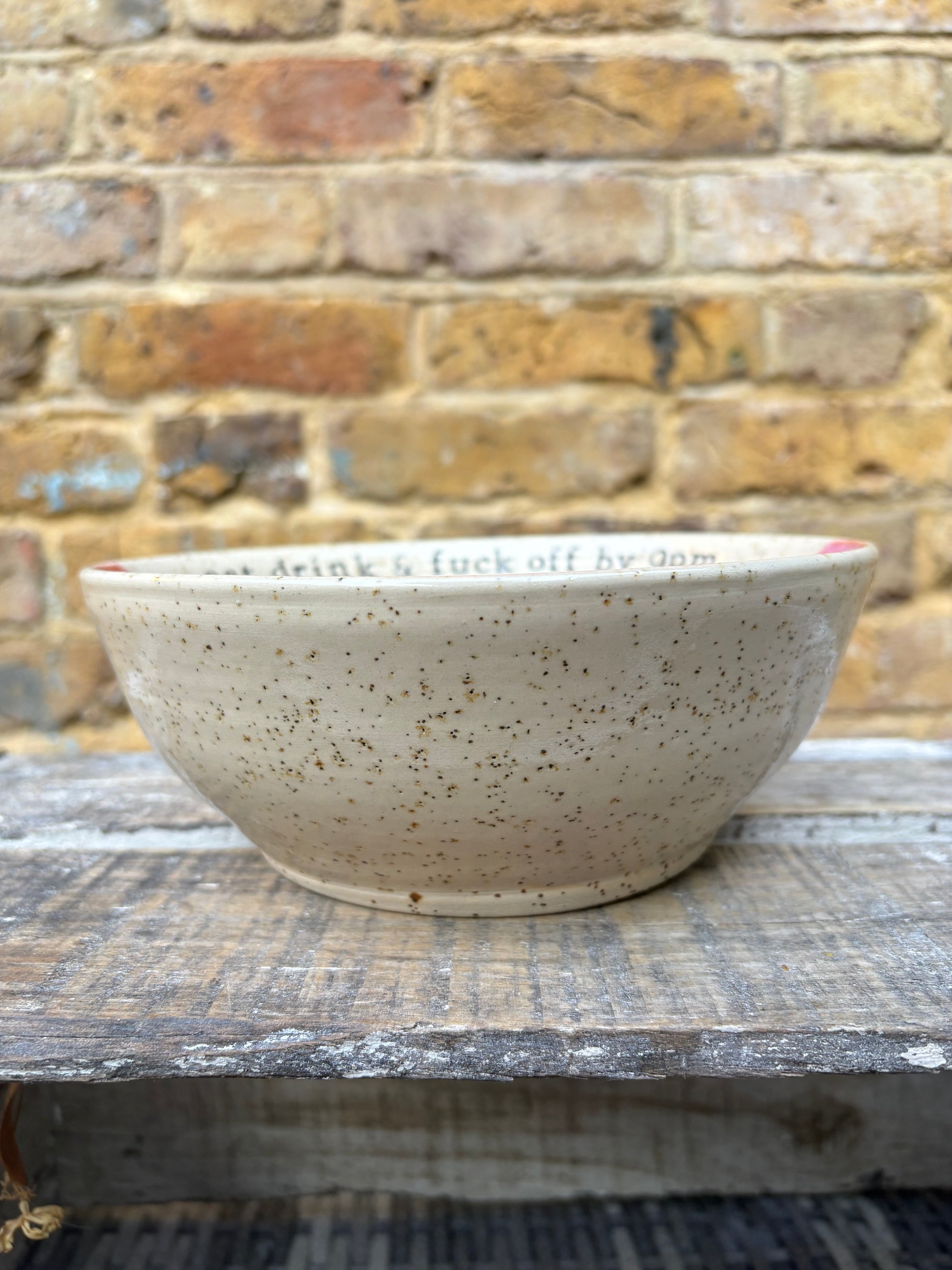 “eat, drink and fuck off by 9pm"  deep round salad/pasta bowl (pink, flecked clay)