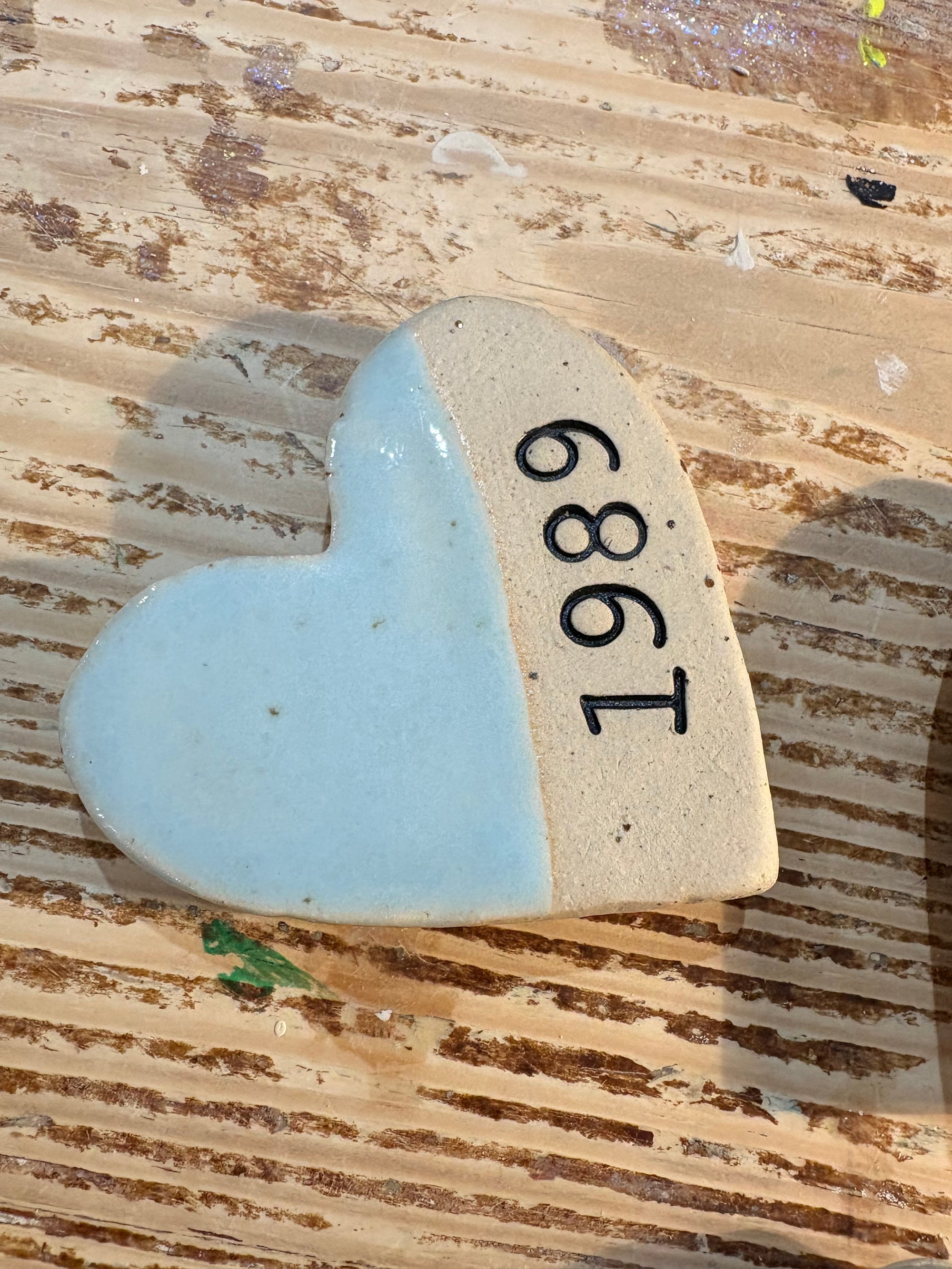 Twelve heart shaped Taylor Swift album magnets